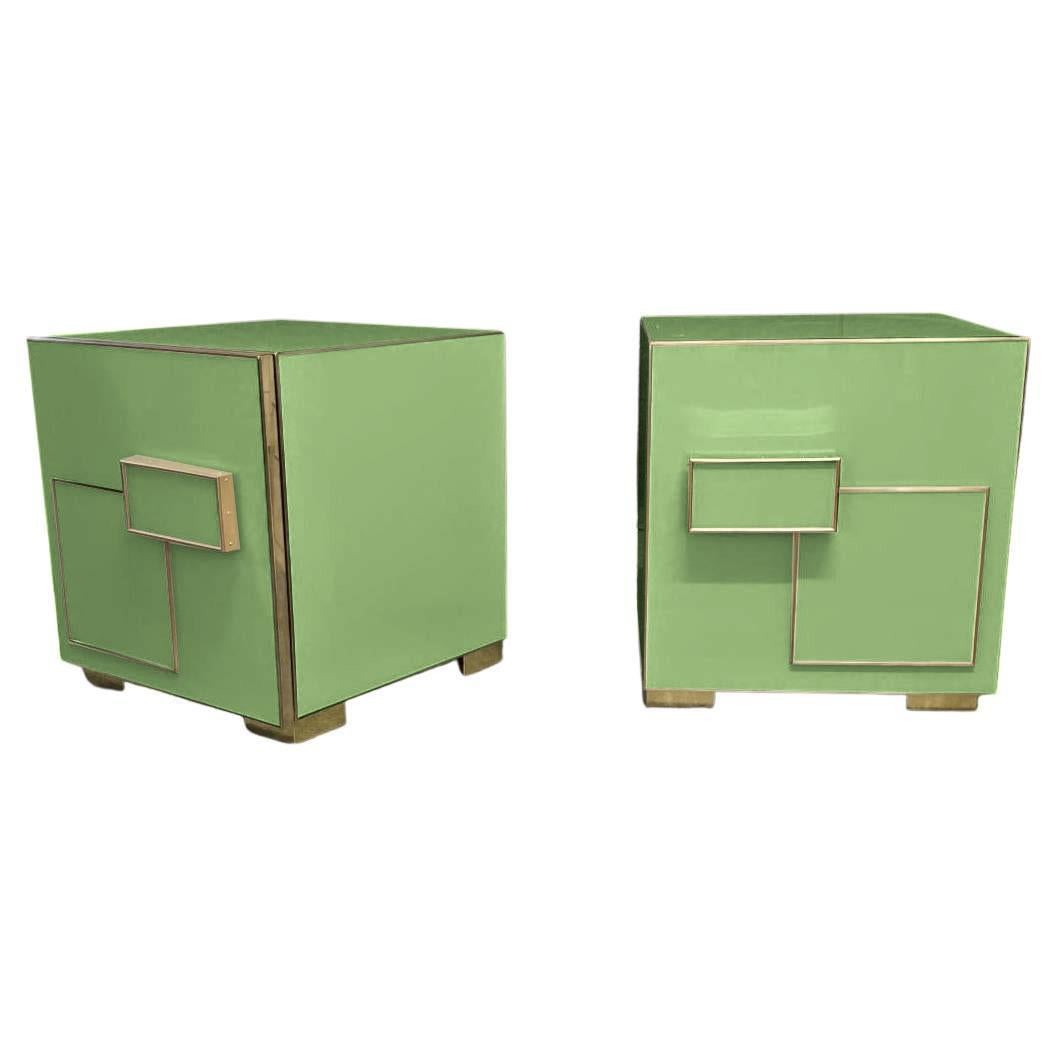 Modernise your interior with this striking pair of Italian Art Deco bedside tables, crafted with meticulous attention to detail.

Each piece features a bold geometric pattern in gleaming brass on a polished green Murano glass surface that exudes