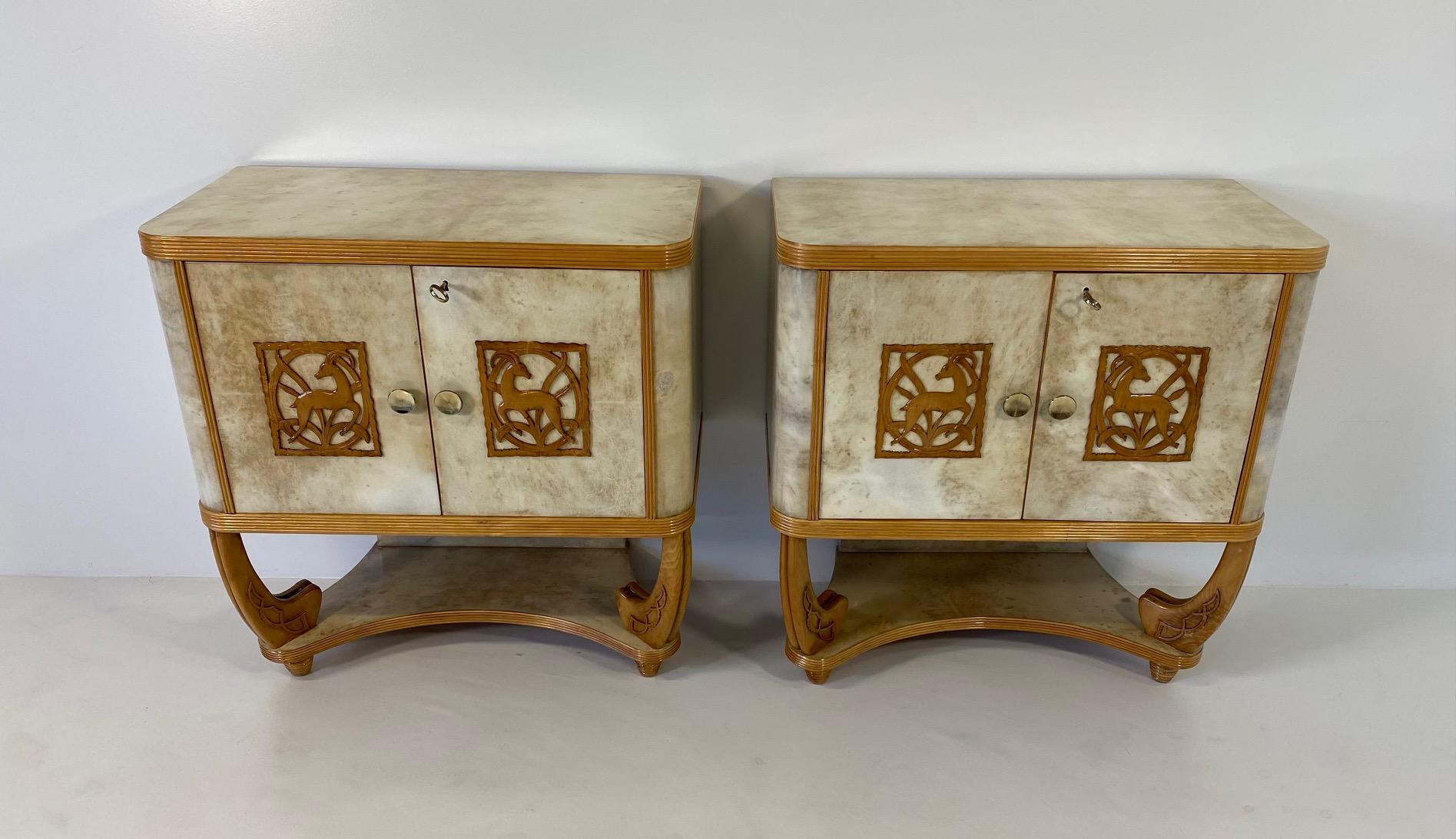 This pair of Art Deco twin cabinets was produced in Italy, more precisely in Torino by Pierluigi colli in the 1930s. 
The top, the background of the base, the doors and the laterals are in fine parchment, which is framed by maple profiles. Also the