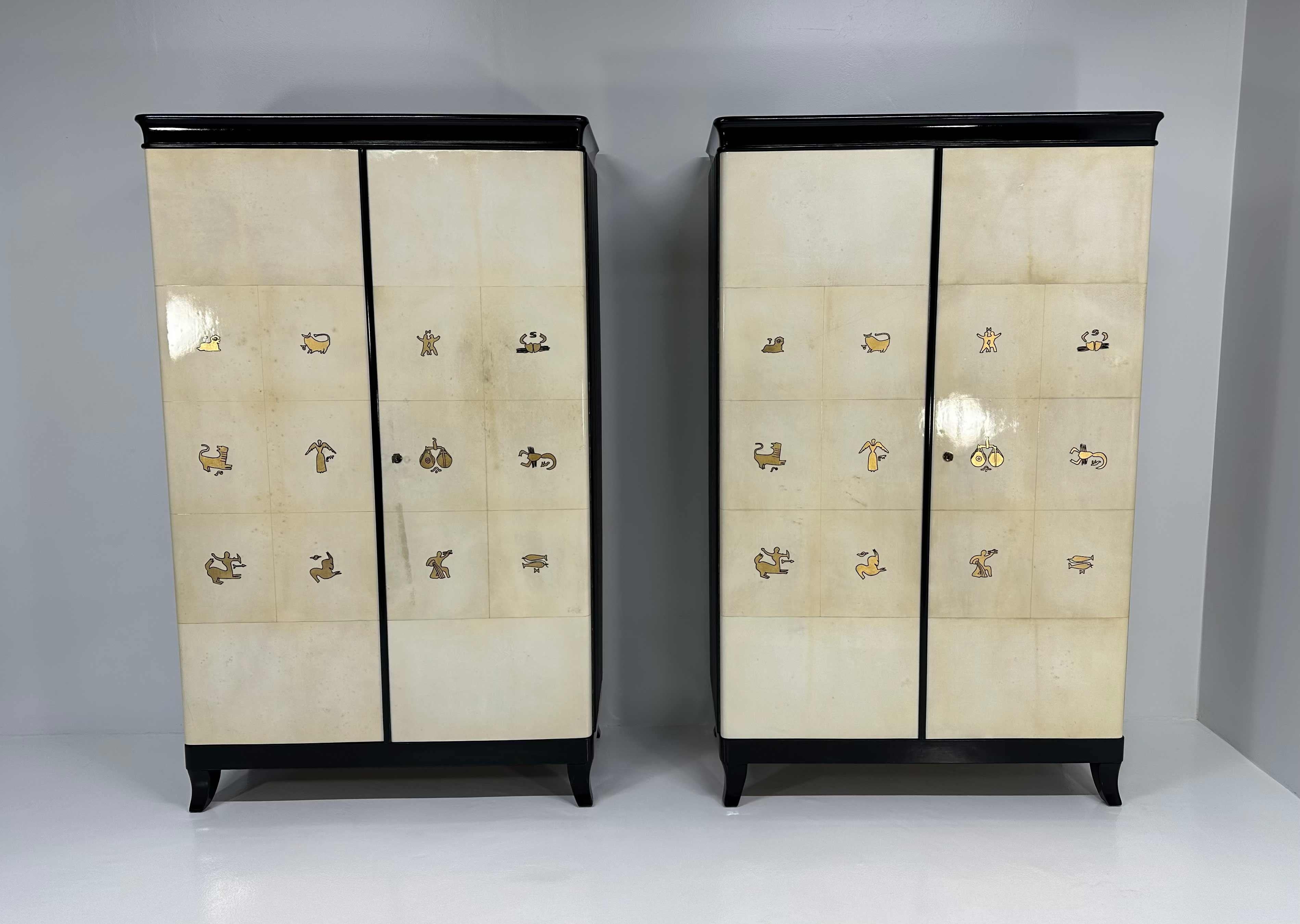 Pair of Italian Art Deco Parchment, Black and Gold Leaf Zodiac Armoires