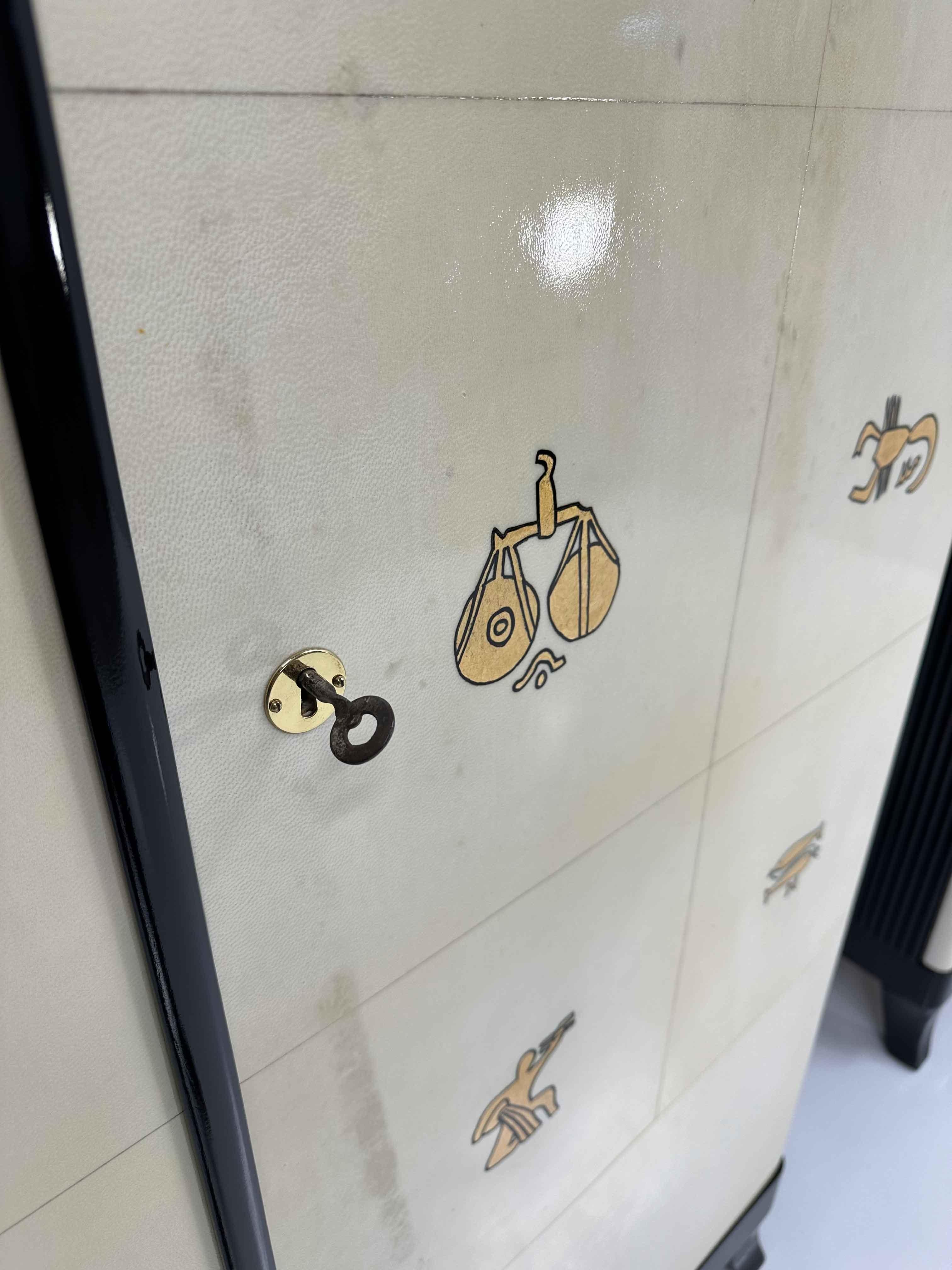 Pair of Italian Art Deco Parchment, Black and Gold Leaf Zodiac Armoires
