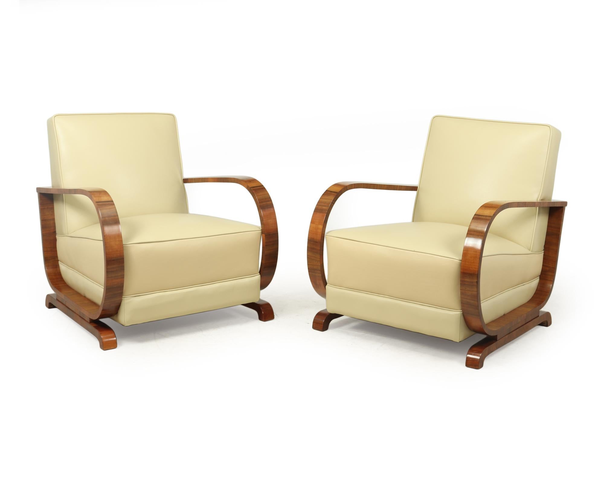 A Pair of Italian Art Deco armchairs produced in Italy in the 1930's, with hooped arms sprung seat and back, these chairs have been fully reupholstered in thick hide leather and the show wood has been professionally hand polished

Age: