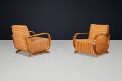 Pair of Italian Art Deco Walnut Lounge Chairs with Curved Arms, Italy 1930s