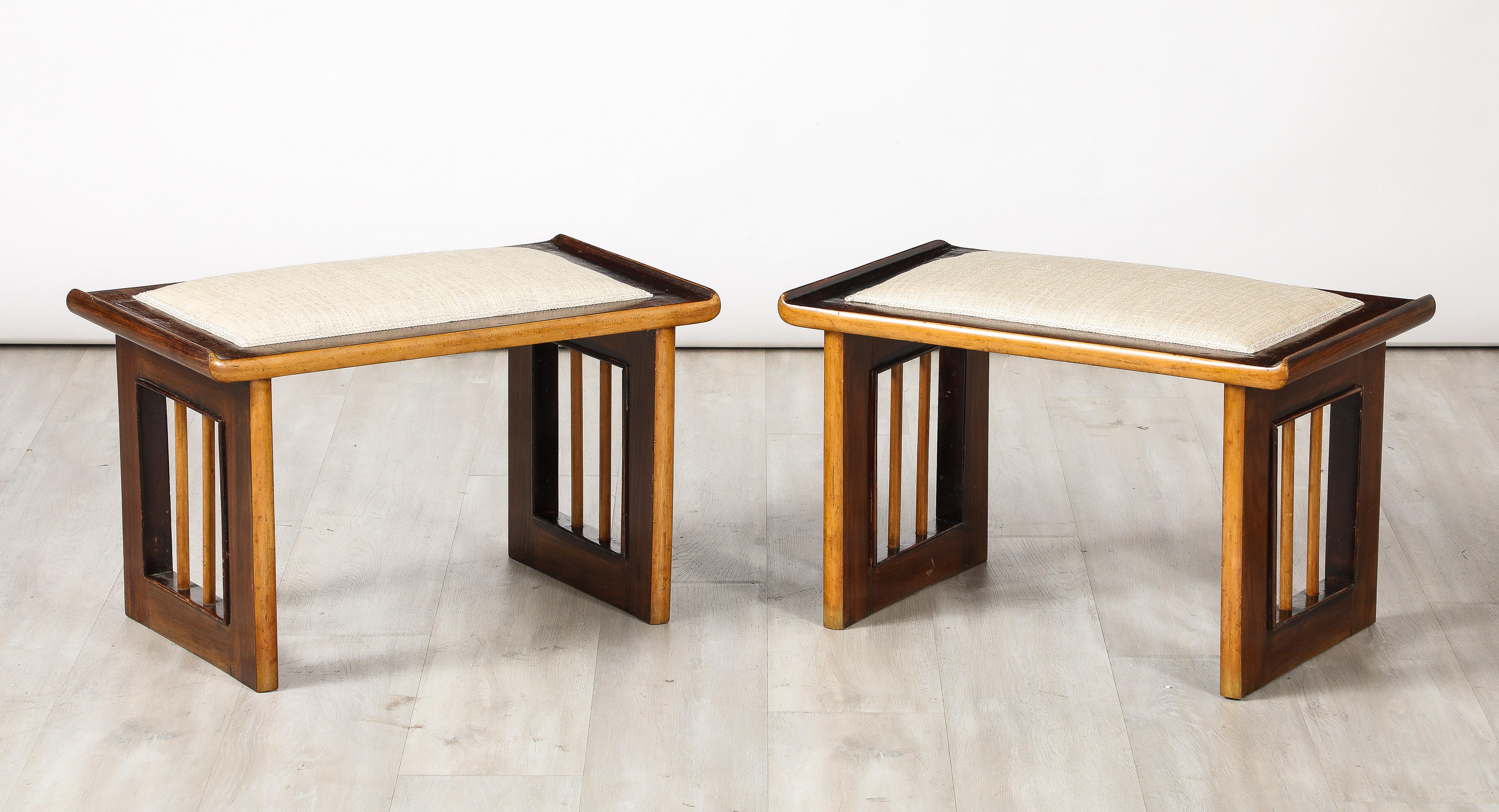 A pair of Italian Art Deco stools, in walnut and fruitwood with an inset linen seat cushion. It's sides with open slats and turned fruitwood spindles.  A wonderful contrast of woods, highly stylish and chic. 
Italy, circa 1940 
Size: 15 1/2