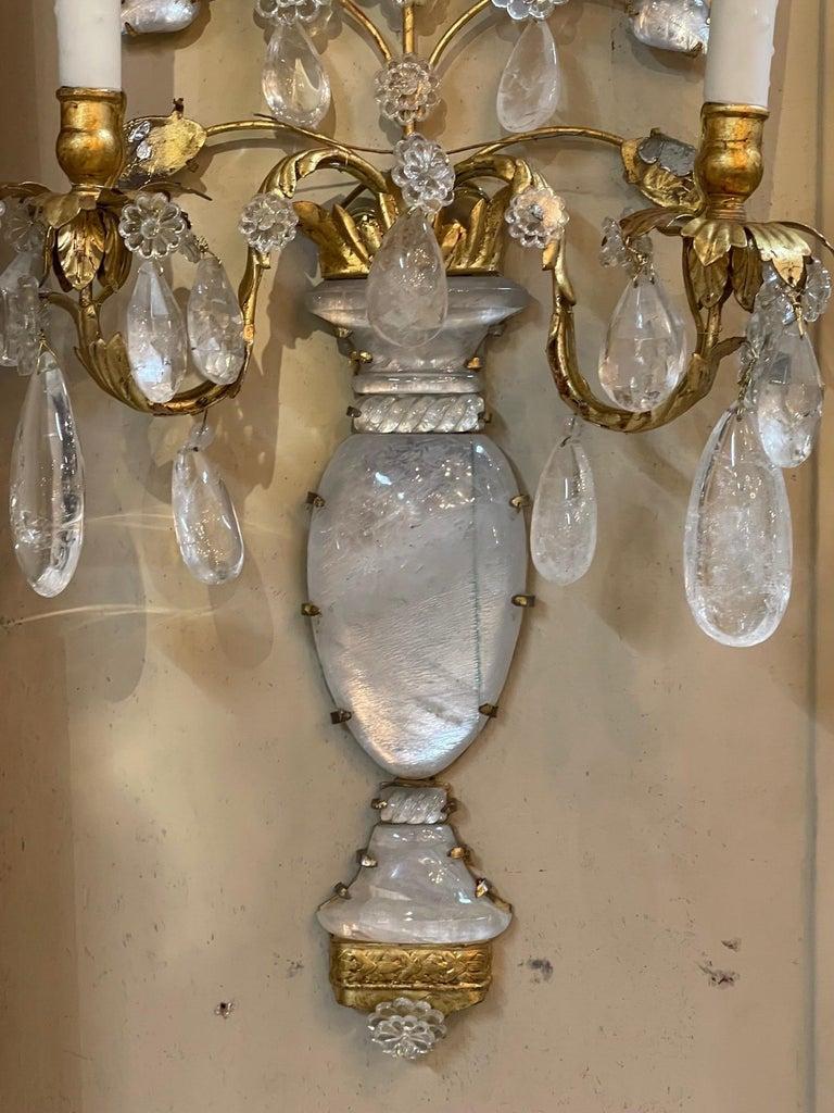 Gorgeous pair of Italian Bagues style rock crystal 2 light wall sconces. The piece features an urn and overflowing flowers. Creates an upscale decorator look. So pretty!