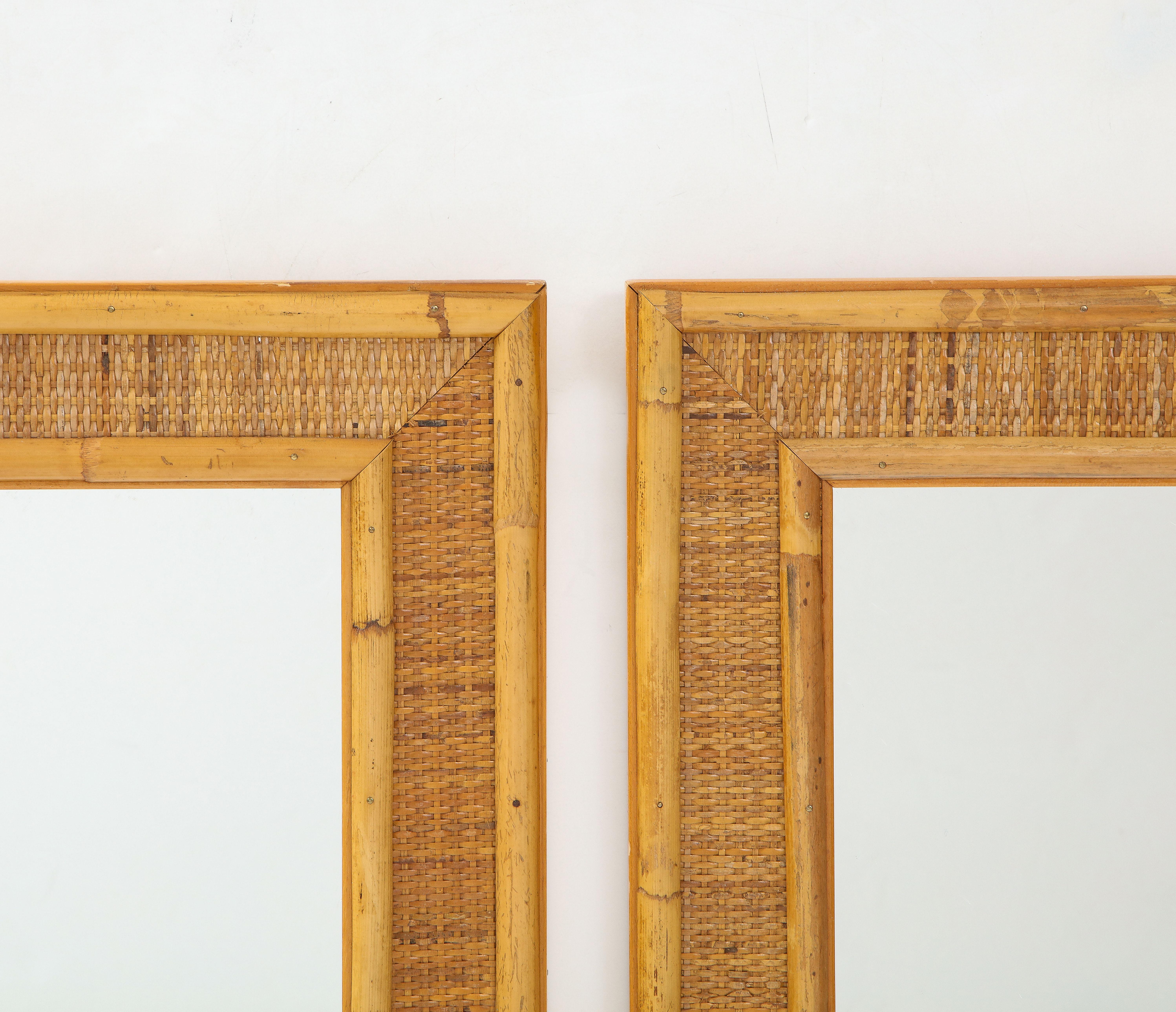 A pair of Italian bamboo and wood decorative wall mirrors. Organic and natural, to enhance any environment. 
Italy, circa 1970 
Size: 51