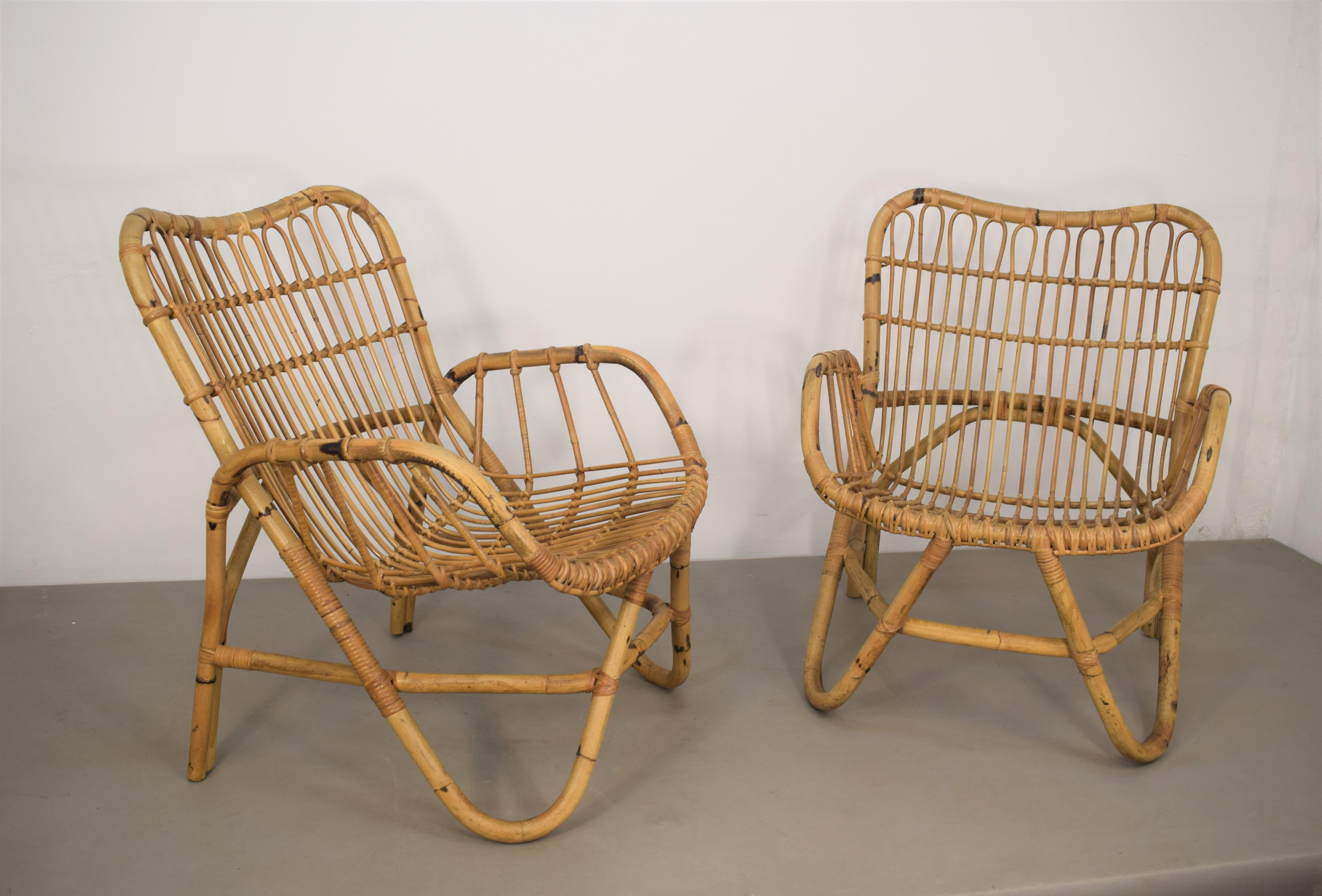 Pair of Italian bamboo armchairs in the style of Tito Agnoli, 1960s.

Dimensions: H= 79 cm; W= 60 cm; D= 76 cm; Height seat = 39 cm.