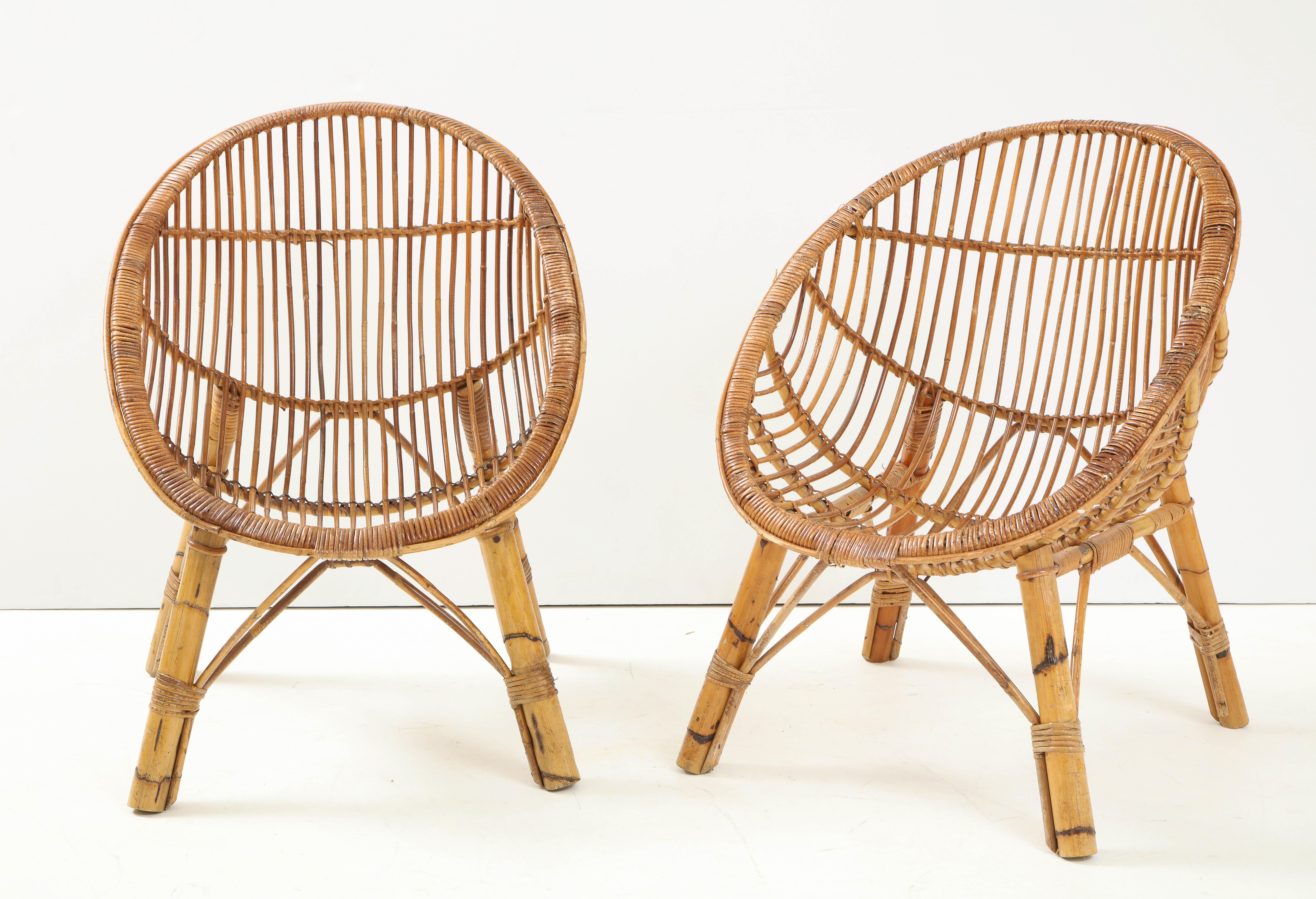 A pair of bamboo armchairs with a charming scoop shape which molds to one's body. Beautiful, organic and sculptural piece to add interest to any setting. 
Italy, circa 1950's 
Size: 33