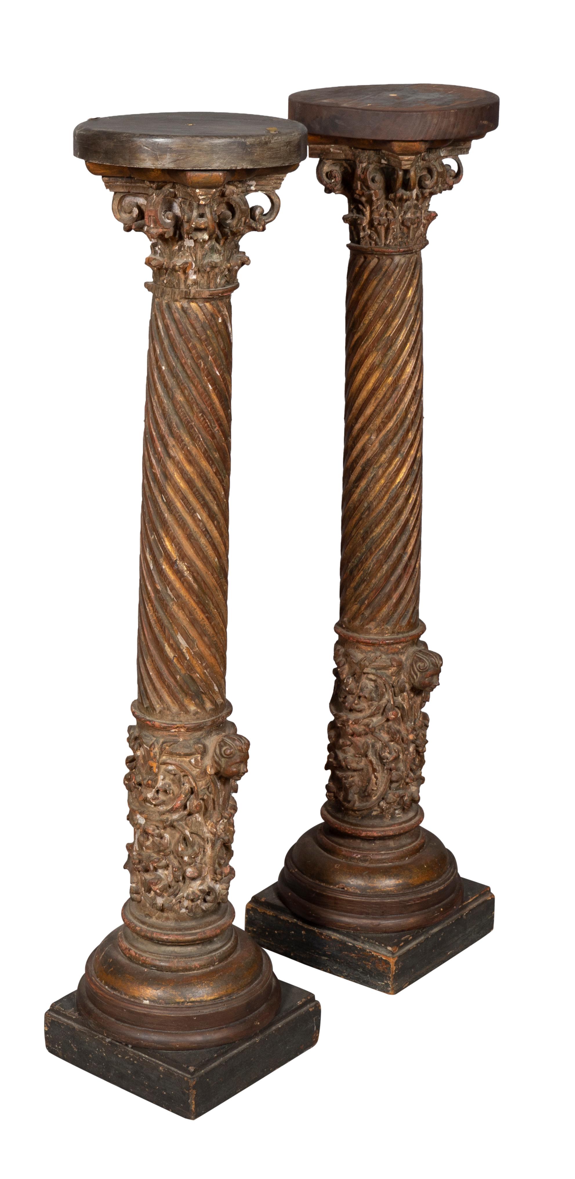 Considered Solomons columns from his temple. With corinthian capitols and spiral fluted columnar support. Plinth base.