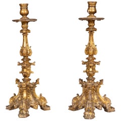 Coppia di candelieri in legno dorato barocco italiano