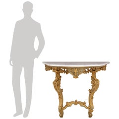 pair of Italian Baroque Period patinated wood and Carrara marble consoles