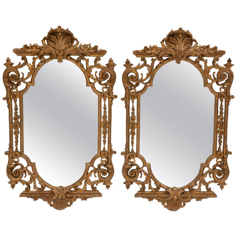 Pair of Italian Baroque Style Carved Giltwood Mirrors For Sale