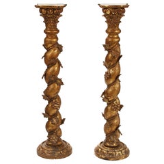 Paire de piédestaux à colonne de style baroque italien en bois doré