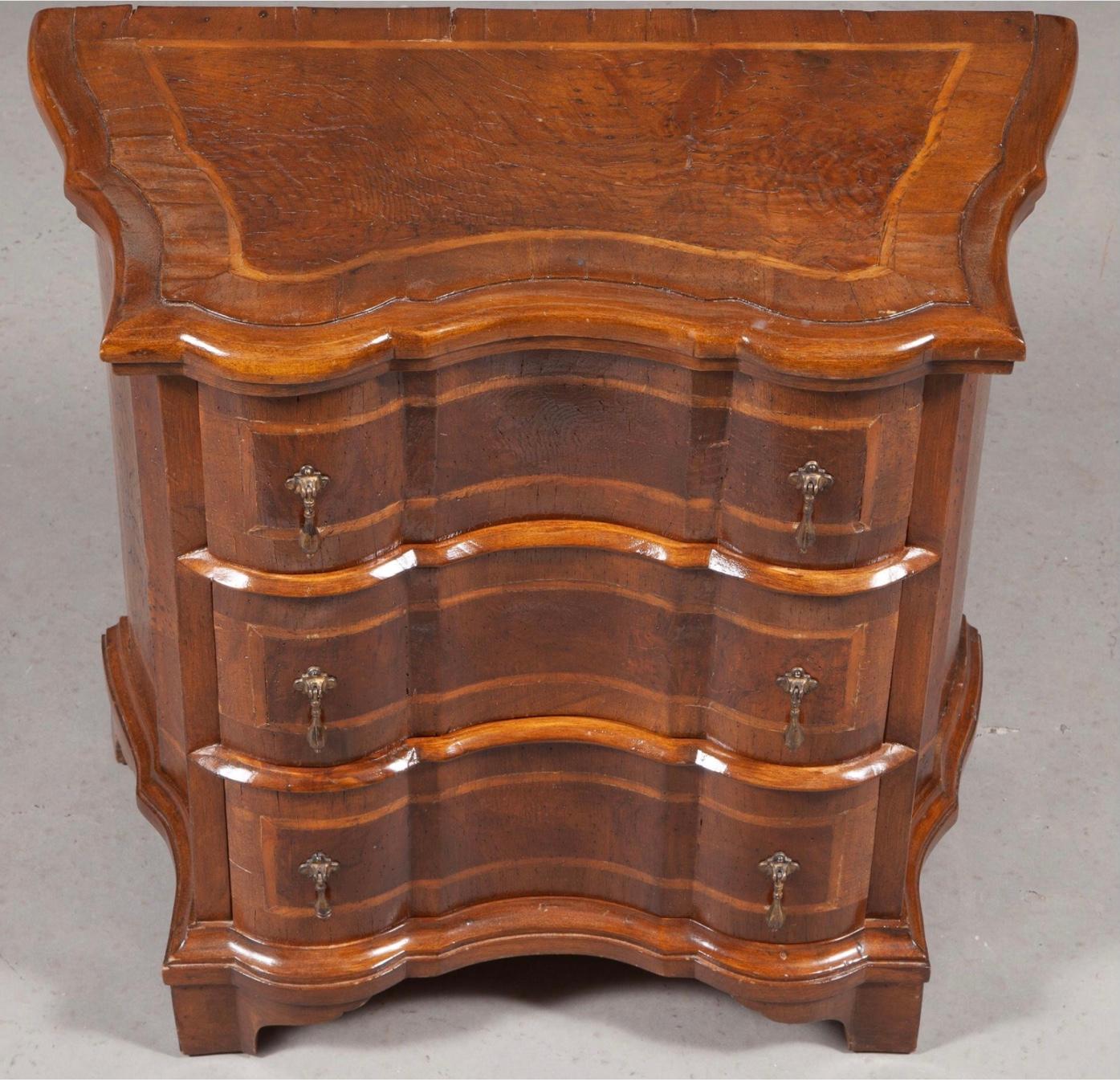This is an exceptionally fine pair of Italian Baroque style walnut bedside commodes. 
Burl and banded veneer. Reverse serpentine fronts and sides. Wonderful old patina. 
They could easily be incorporated into an interior as nightstands or side