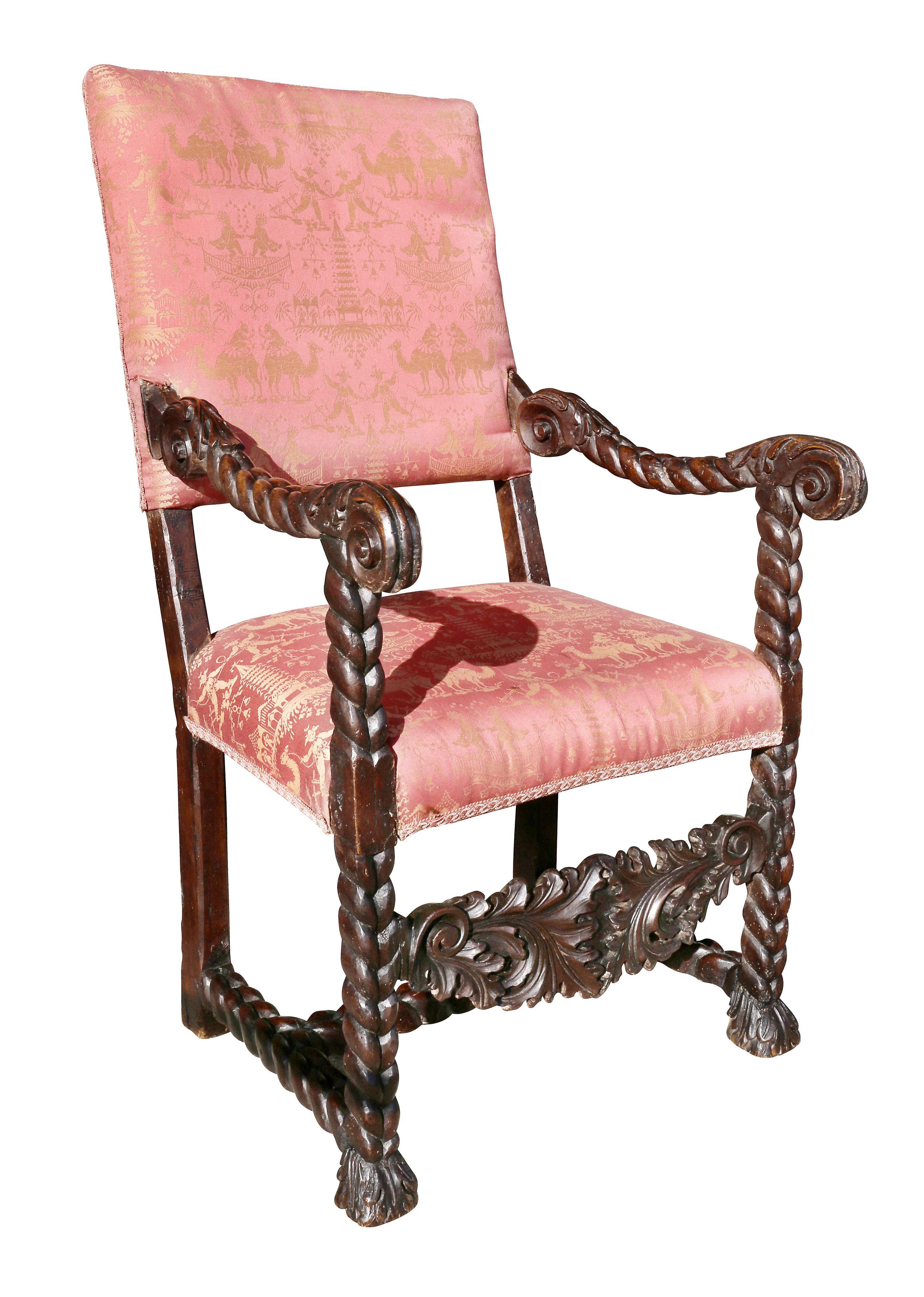 Each with upholstered back and seat, rope twist carved arms and legs with carved acanthus leaf stretcher and an H form rope carved stretcher.