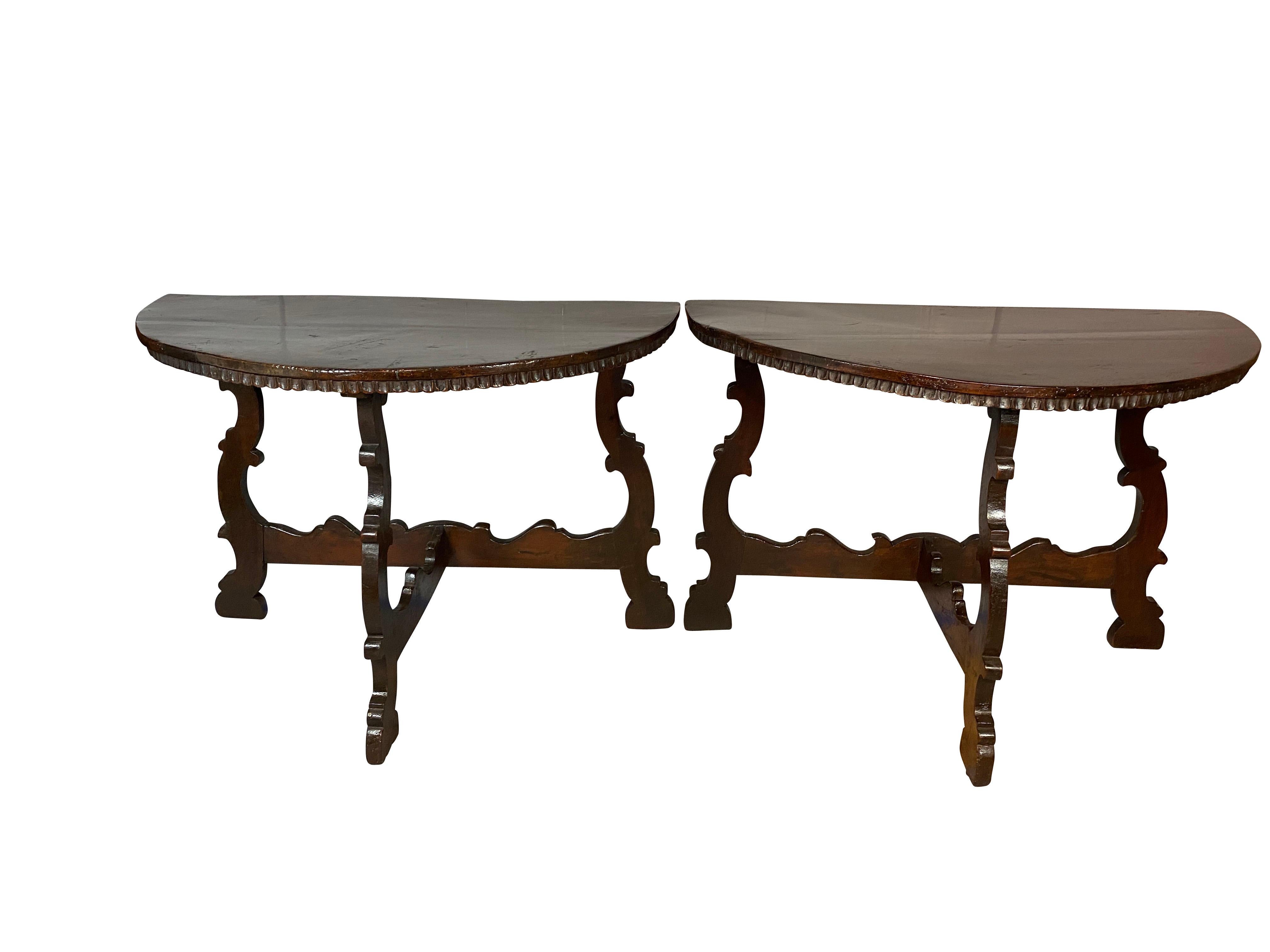 D shaped top with fluted molding over scroll legs with conforming stretchers.