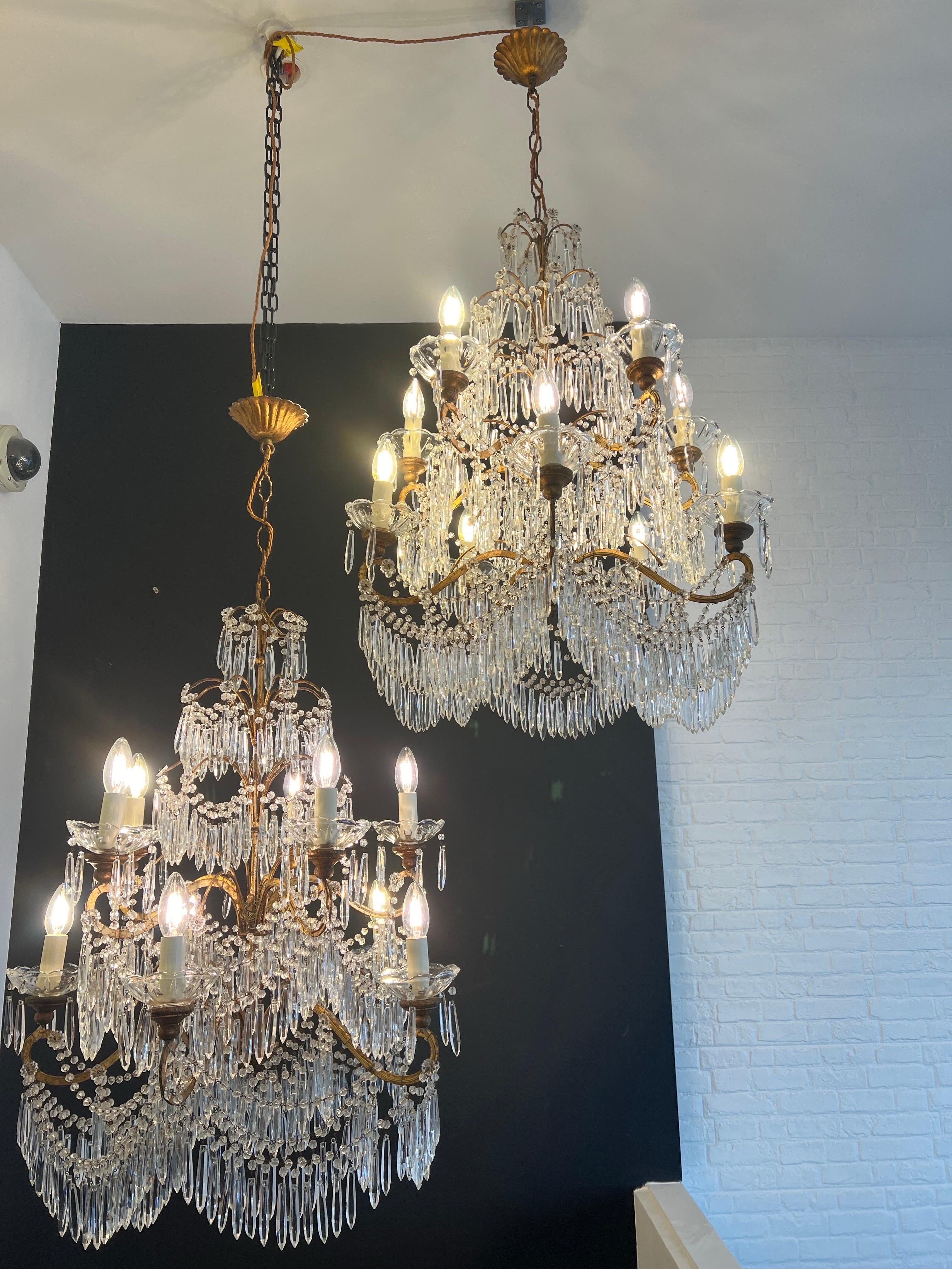 An exquisite pair of Italian beaded with crystal drops chandeliers each with 10 candle lights sitting on crystal plates . A beautiful five tiered structure in gilt metal newly rewired . C1920s Italy 
Measurements with original chain 110cm