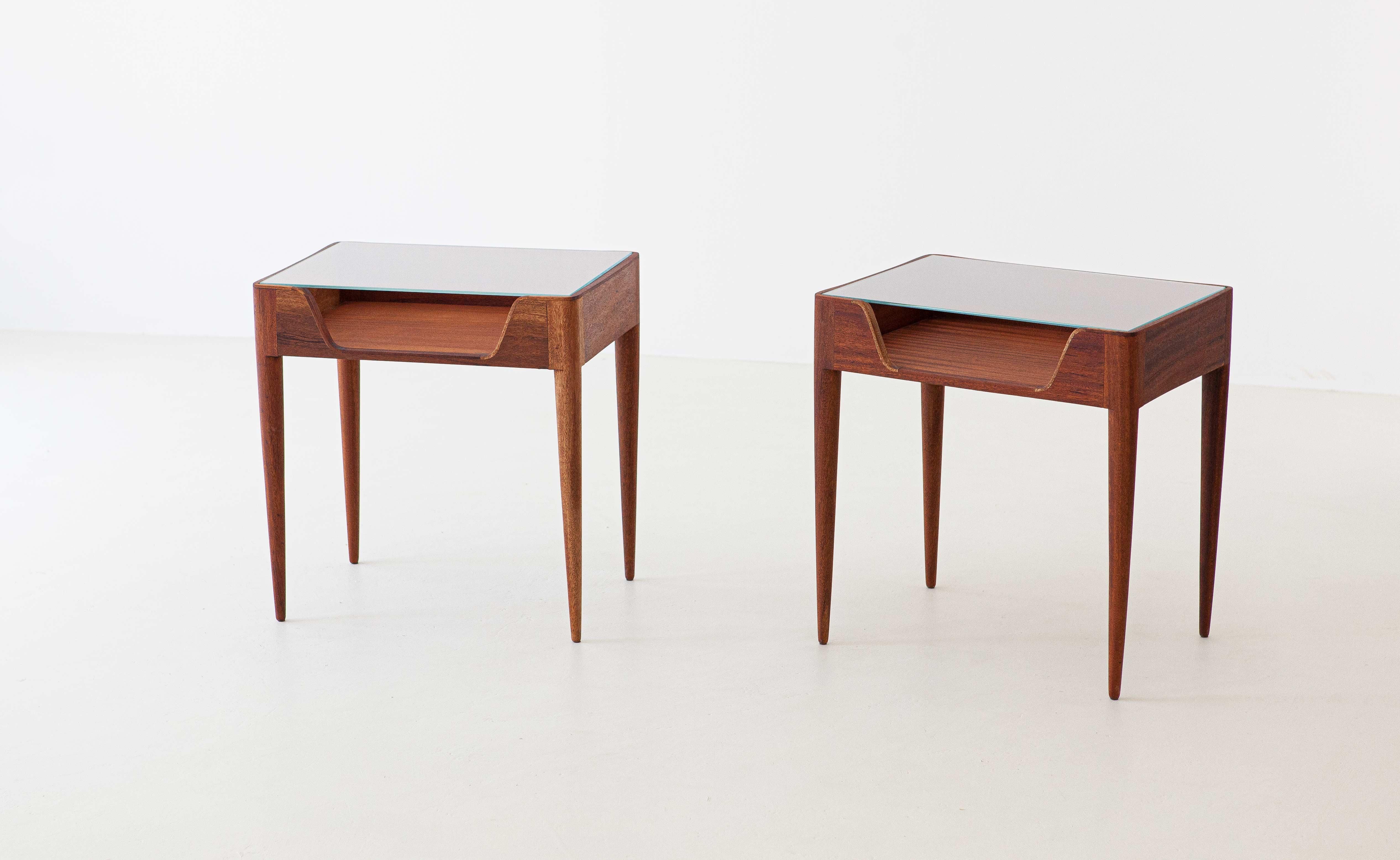 Set of two nightstands, manufactured in Italy during the 1950s by Fratelli Strada.
These two side tables has made of solid wood with conical legs and glass top.
Airy and modern design
The wood is rich in details and it is of excellent quality but