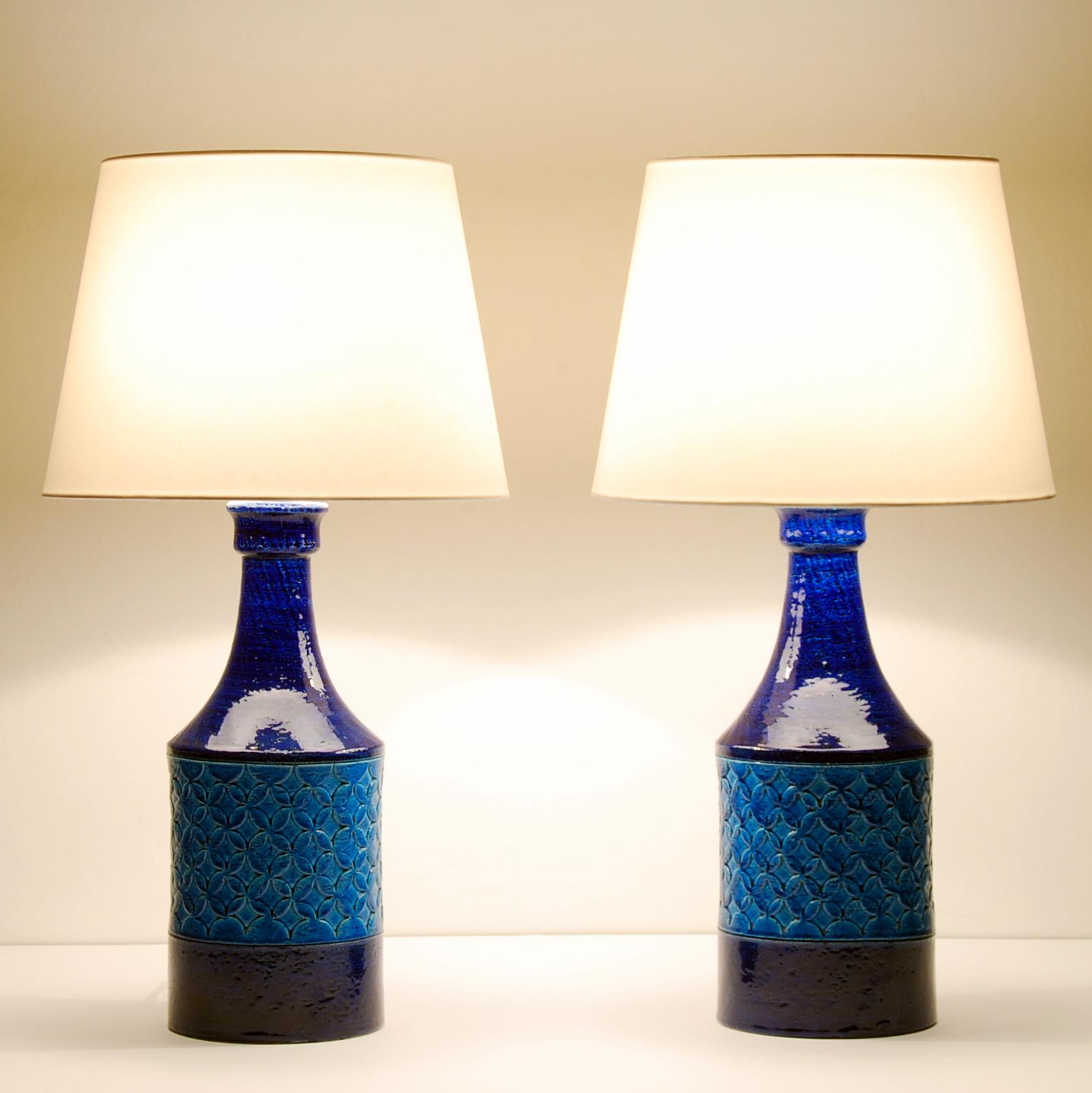 A pair of Bitossi chamotte clay two-tone blue glazed table lamps. The ceramic body without the lamp-socket measures: 37 cm. We are selling these table lamps without the shades.

        