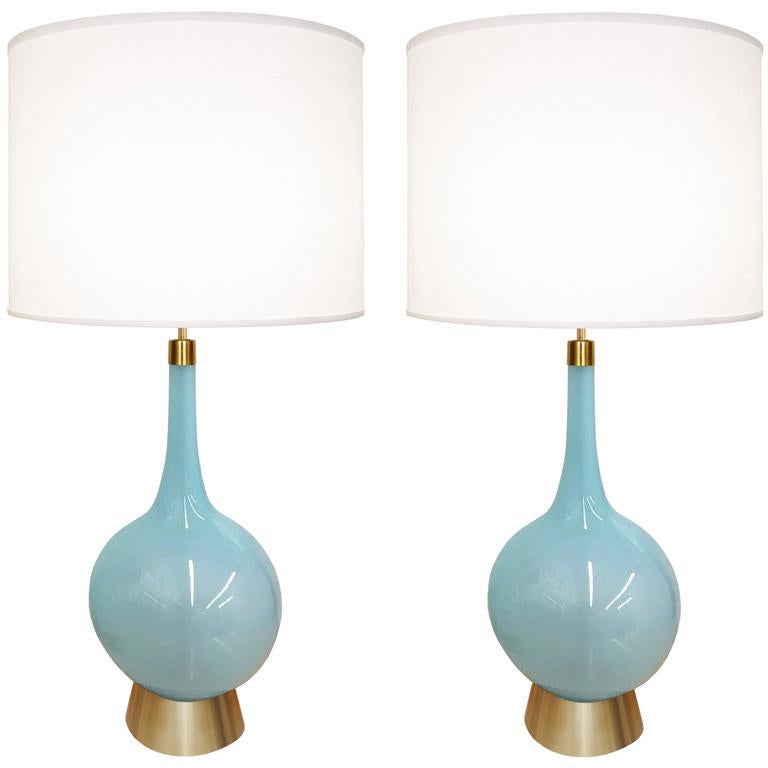 A pair of blue glass lamps with brass bases and hardware.

Italian, Circa 1960's

Lamp Shades Are Not Included.

If you are interested in Lamp Shades, please email The Craig Van Den Brulle Design Team Via Message Center, and we will provide you with