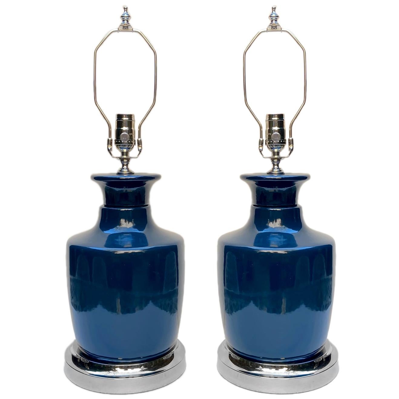 A pair of circa 1950s Italian blue table lamps with silver plated bases.

Measurements:
Height of body 13