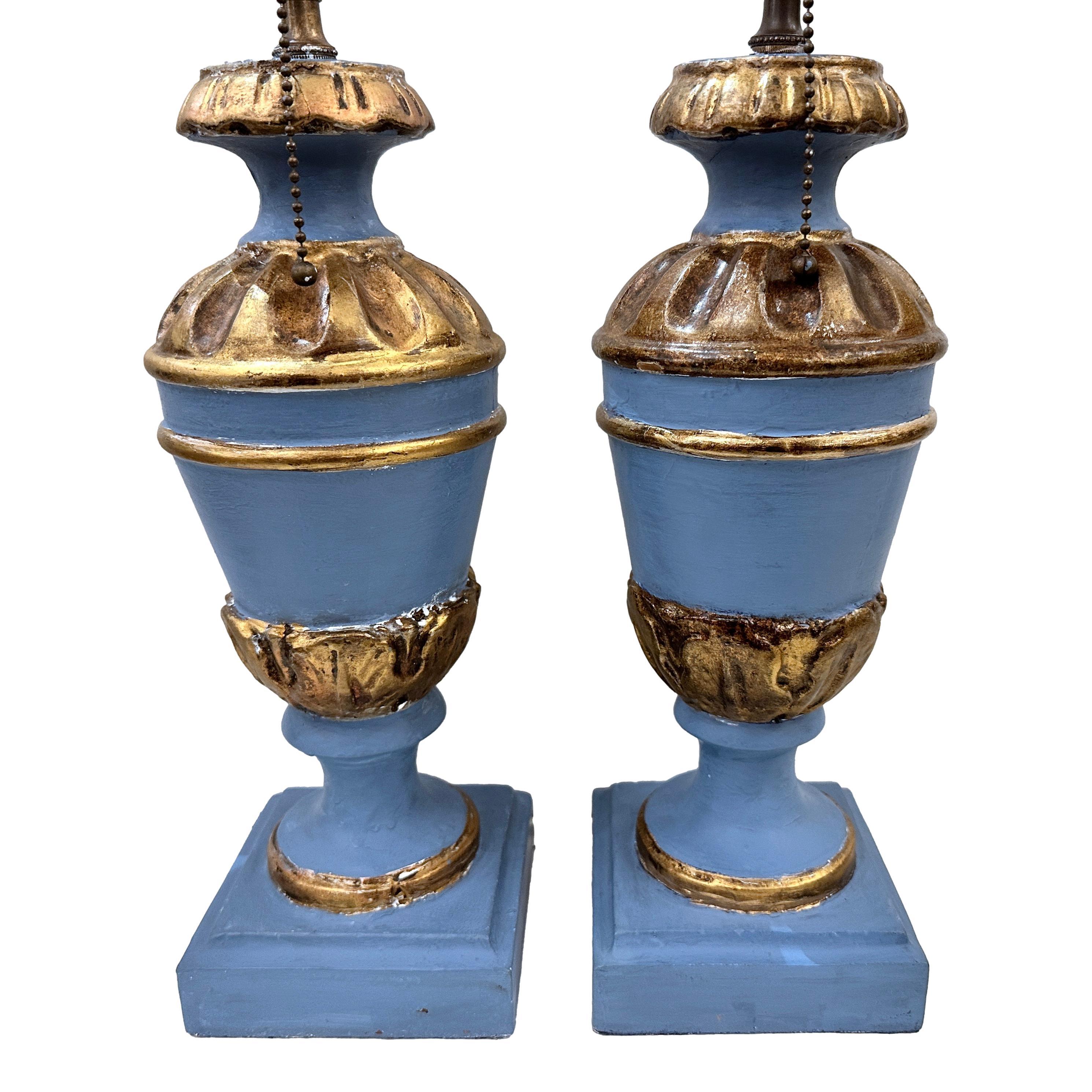 Pair of Italian circa 1920's painted and gilt wood table lamps with pedestal base.

Measurements: 
Height of body: 14