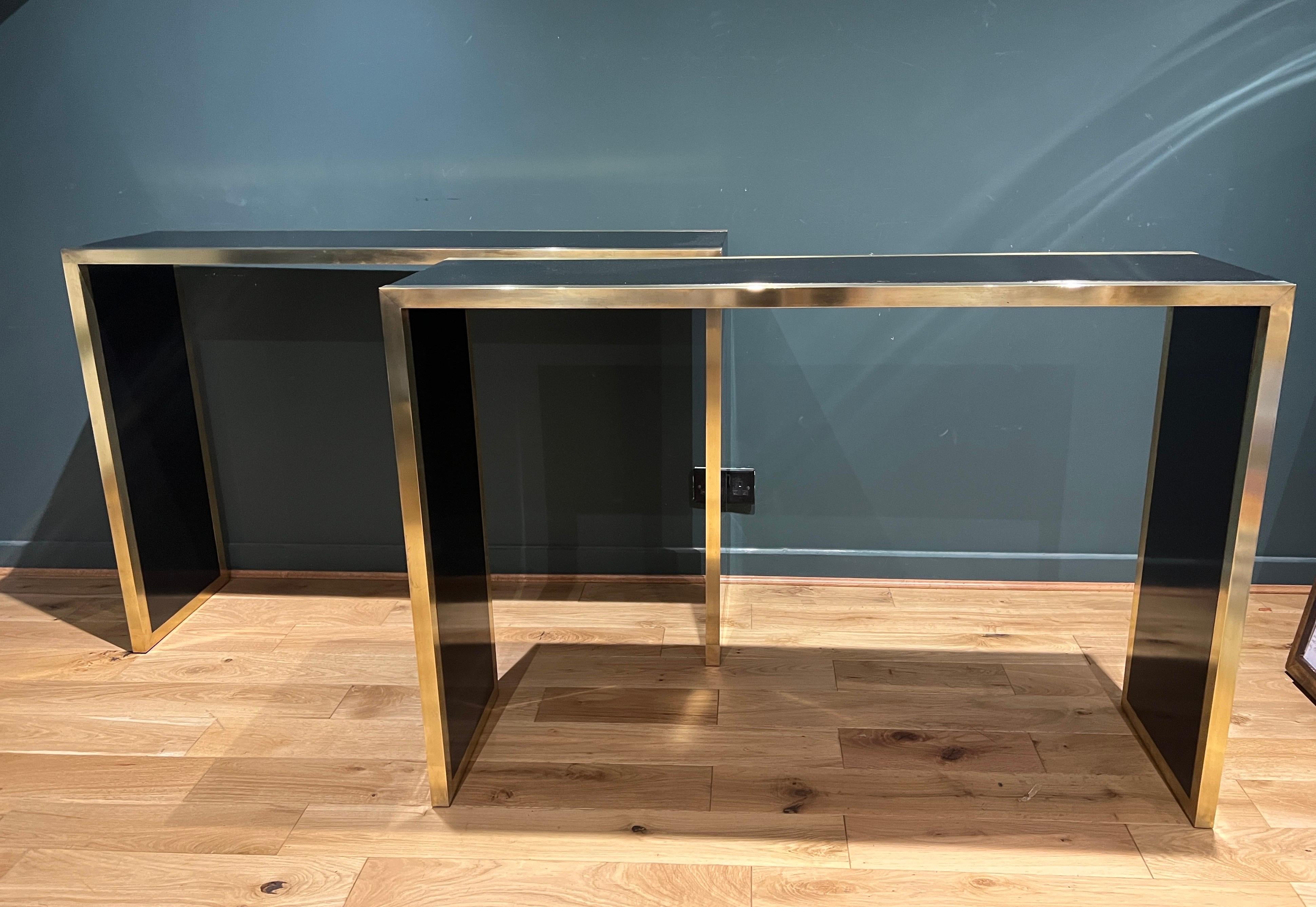 A fine pair of Italian 70s console tables in brass and black lacquer wood . At. Romeo REGA 