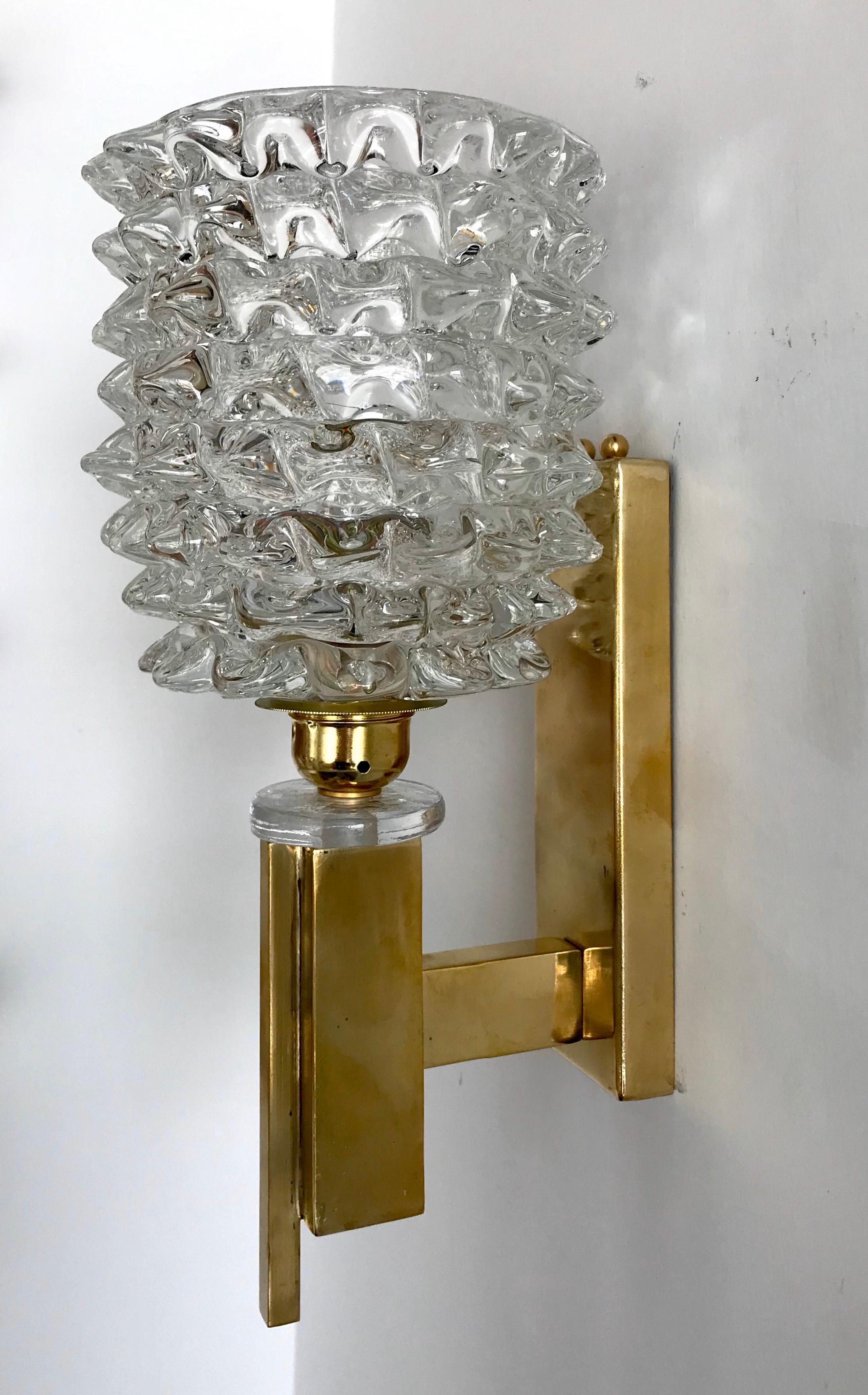 A pair of beautiful midcentury Murano blown glass and brass sconces.
