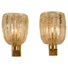 Paire d
appliques italiennes en laiton et verre de Murano de type bullicante