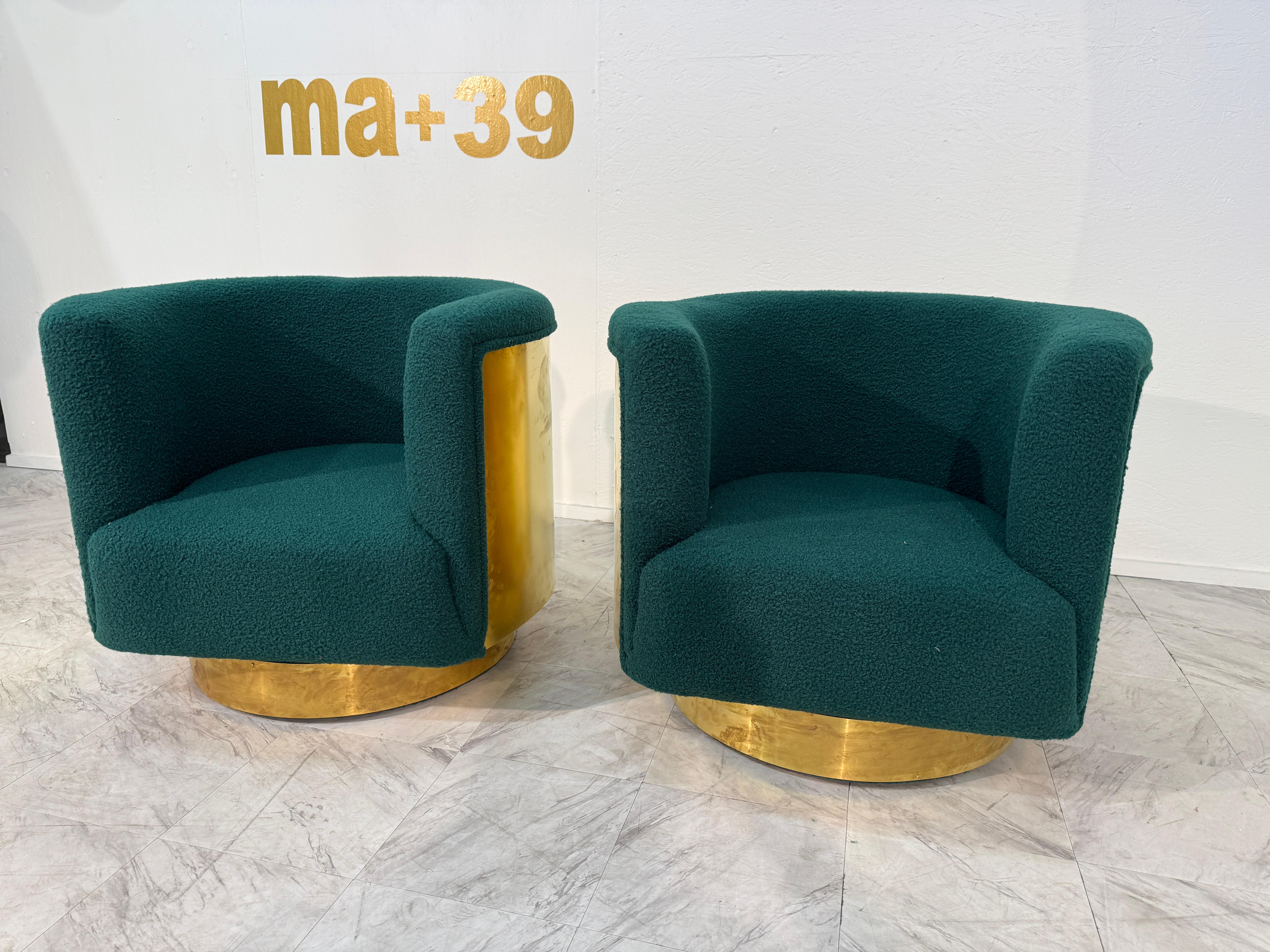 This pair of Italian armchairs, upholstered in deep turquoise bouclé, offers a lush and tactile seating experience. The curved barrel-back design provides both comfort and visual appeal, enveloping the sitter in a sculptural form. A polished brass