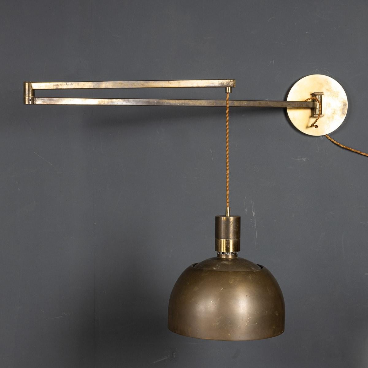 Eccentric pair of articulated wall lights made in Italy circa 1960s. These lights were designed by Franco Albini and Franca Helg and given to Sirrah Imola to manufacture. Its adjustable arm makes it possible to arrange the light partition to one's