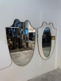 Pair of Italian Brass Framed Shield Form Wall Mirrors, 1950s