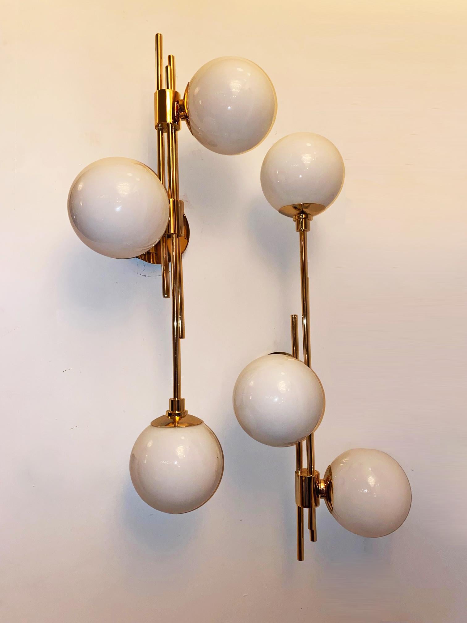 Pair of brass gold plated and hand blown Italian glass balls wall sconces.
Versatile hanging. 3 G9 sockets.