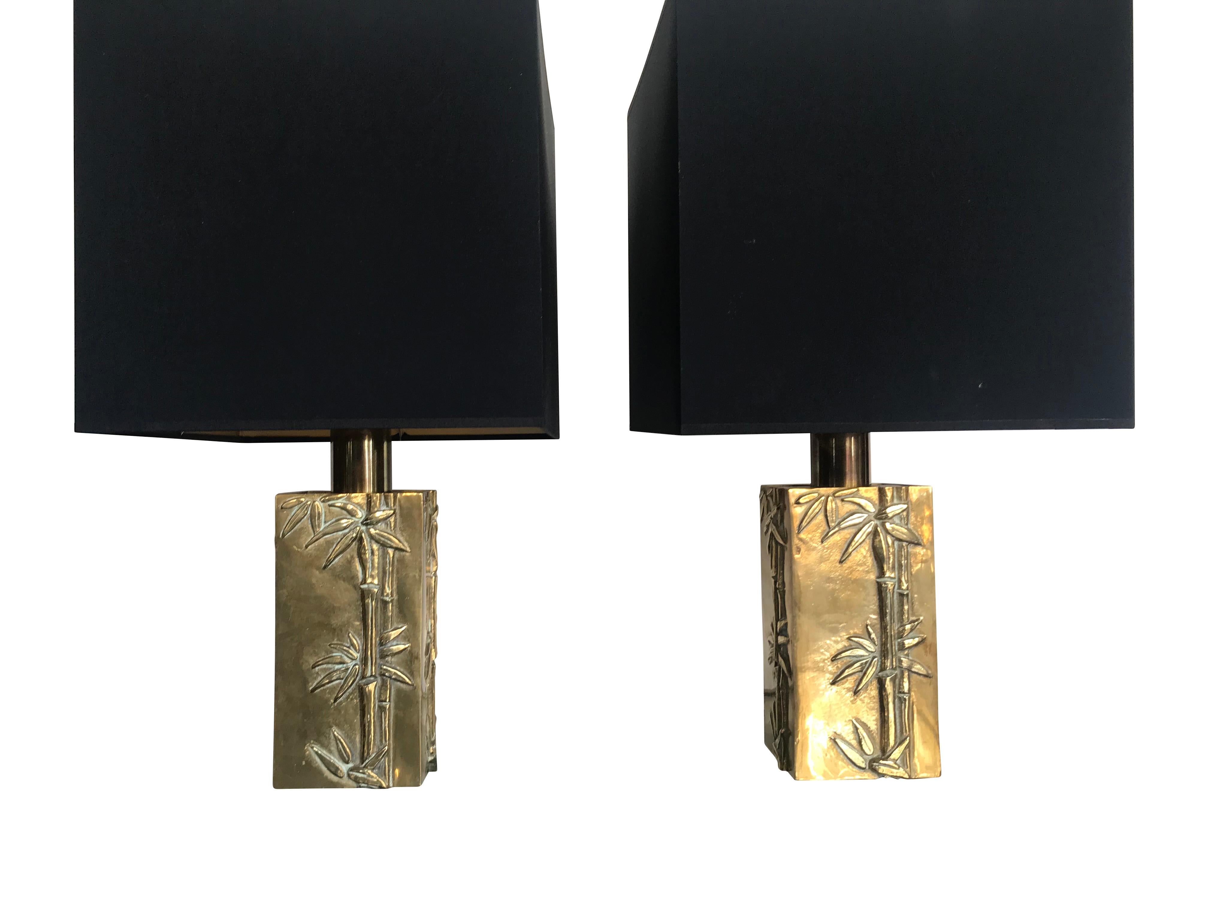 A pair of Italian solid brass lamps with bamboo relief design and brass fittings, by Pragos, Italy. With new bespoke black shades with gold linings. Re wired with antique gold cord flex and PAT tested. 

 