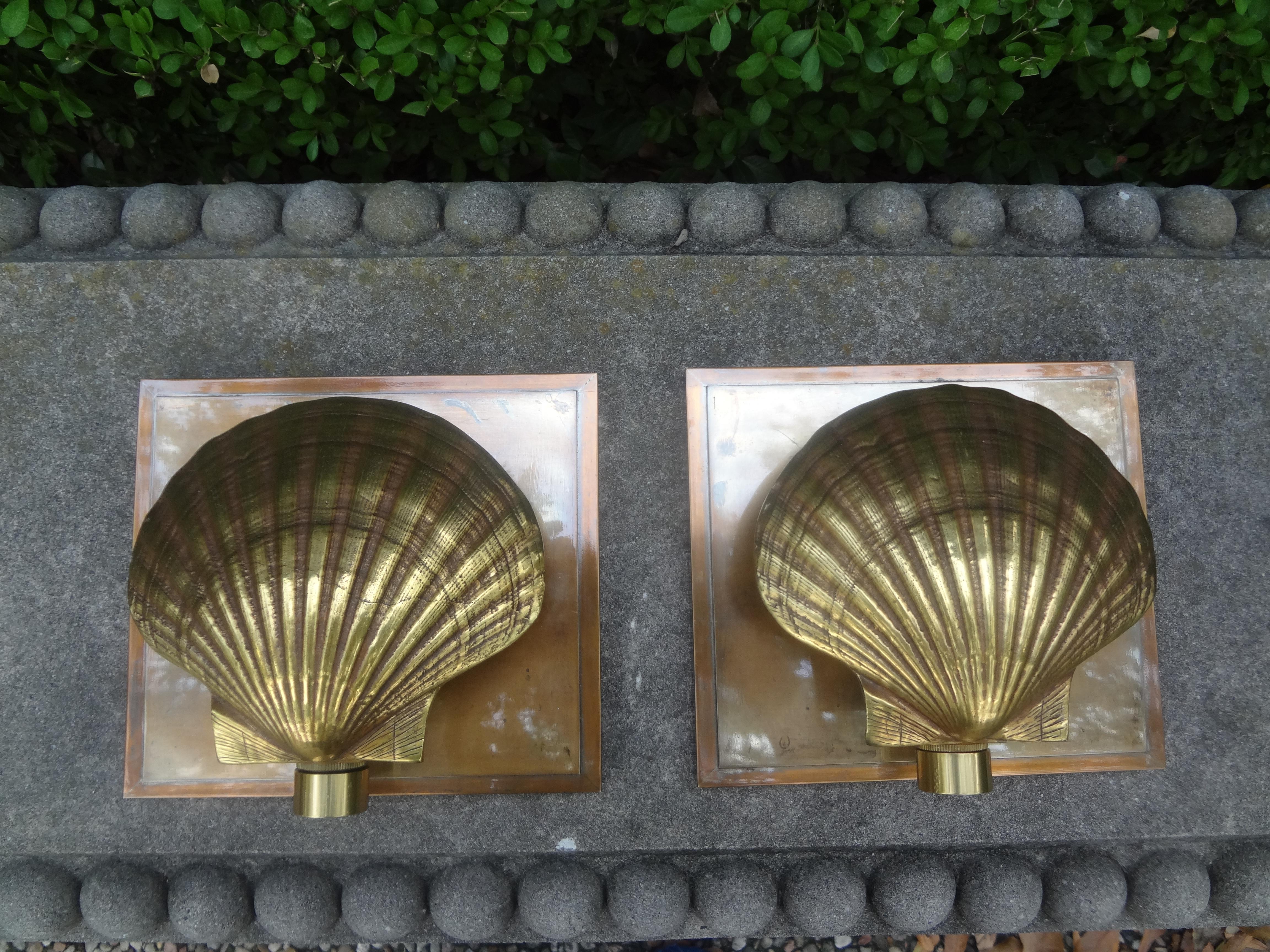 Pair of Italian brass seashell sconces. This Lovely Well Made Pair Of Italian Maison Jansen Or Maison Bagues Style Brass Shell Sconces Have Beautiful Patina And Have Been Newly Wired For The American Market.