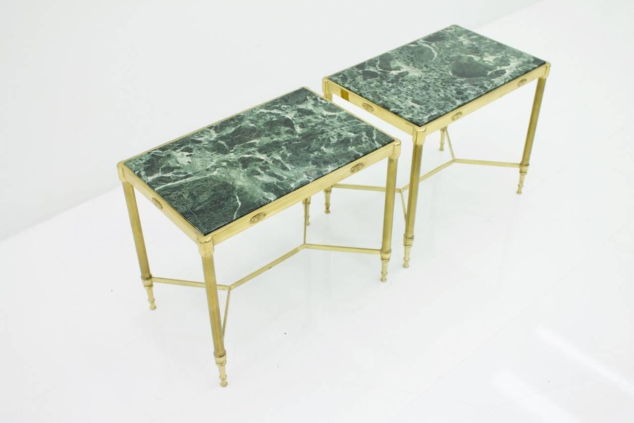 Beautiful set of two side tables 1950s from Milan. Two brass side table with original green marble plate, polished.
Good condition.

 