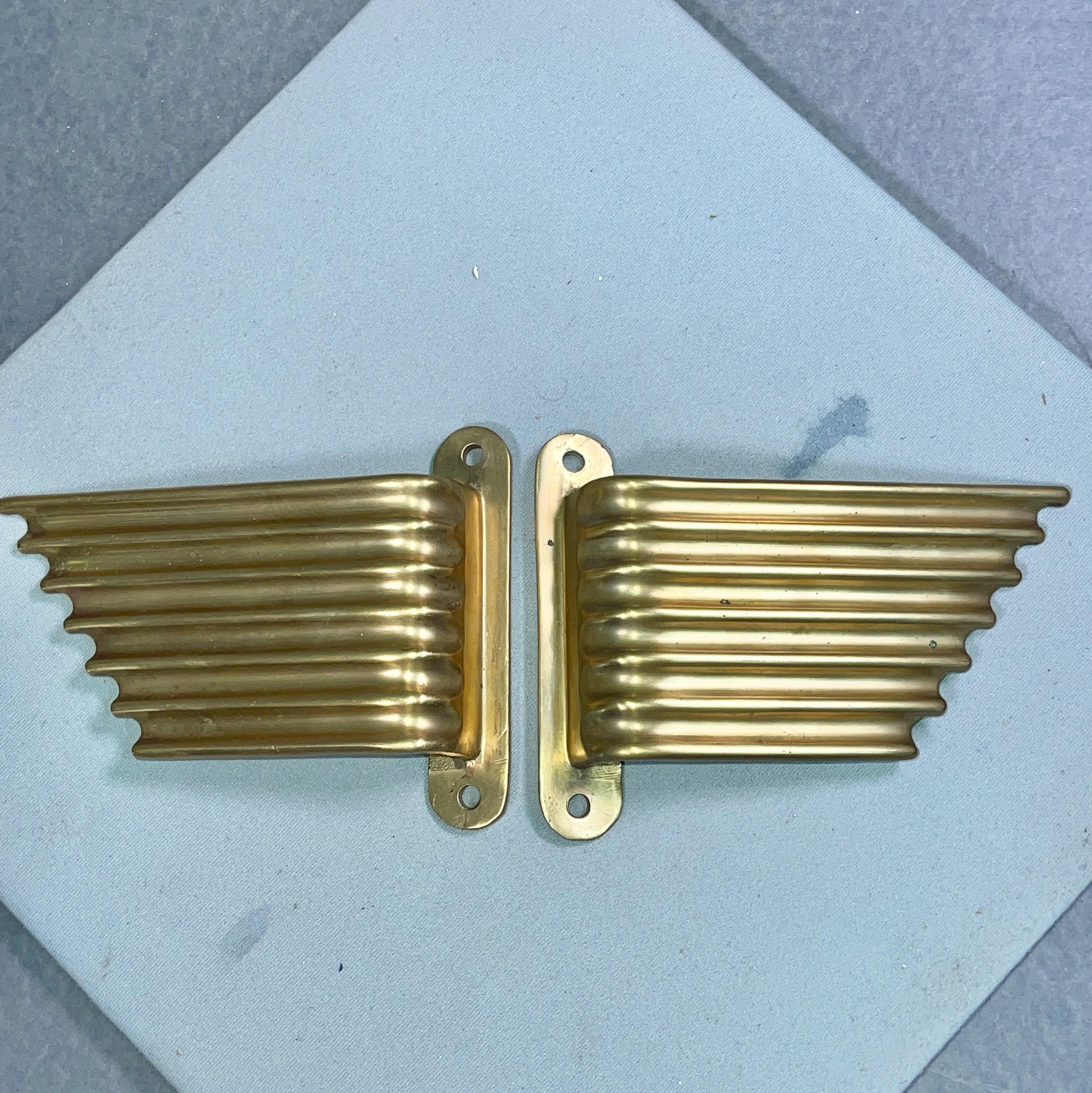 Pair of Italian brass wing form door pulls. New old stock