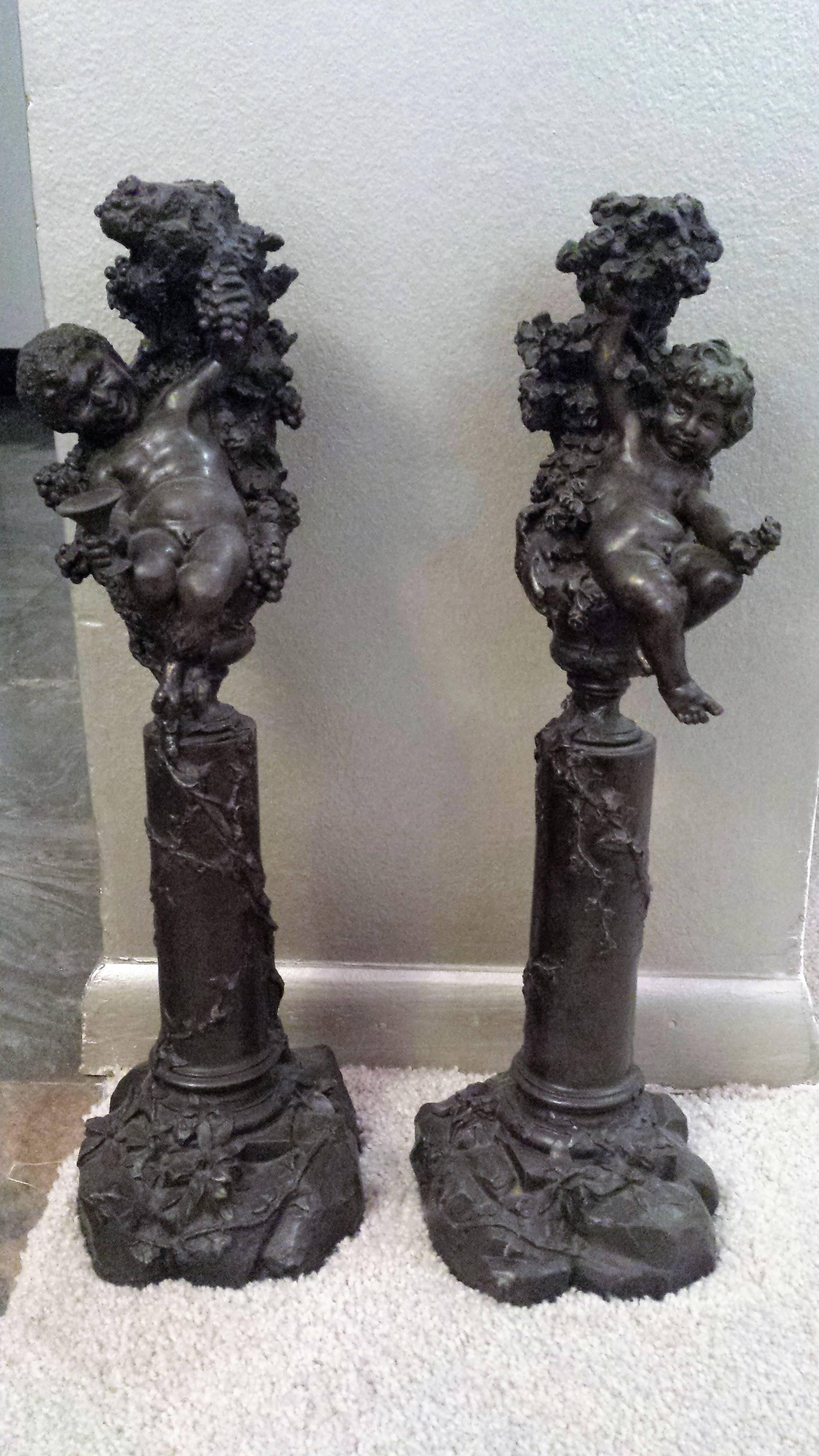 A lovely pair of bronze statues depicting joyous cherubic figures. 
Can be used as a sculpture or as single candle candleholders
The cherub figure was used a lot in Renaissance art and represented as a naked, chubby male baby or child. 
During