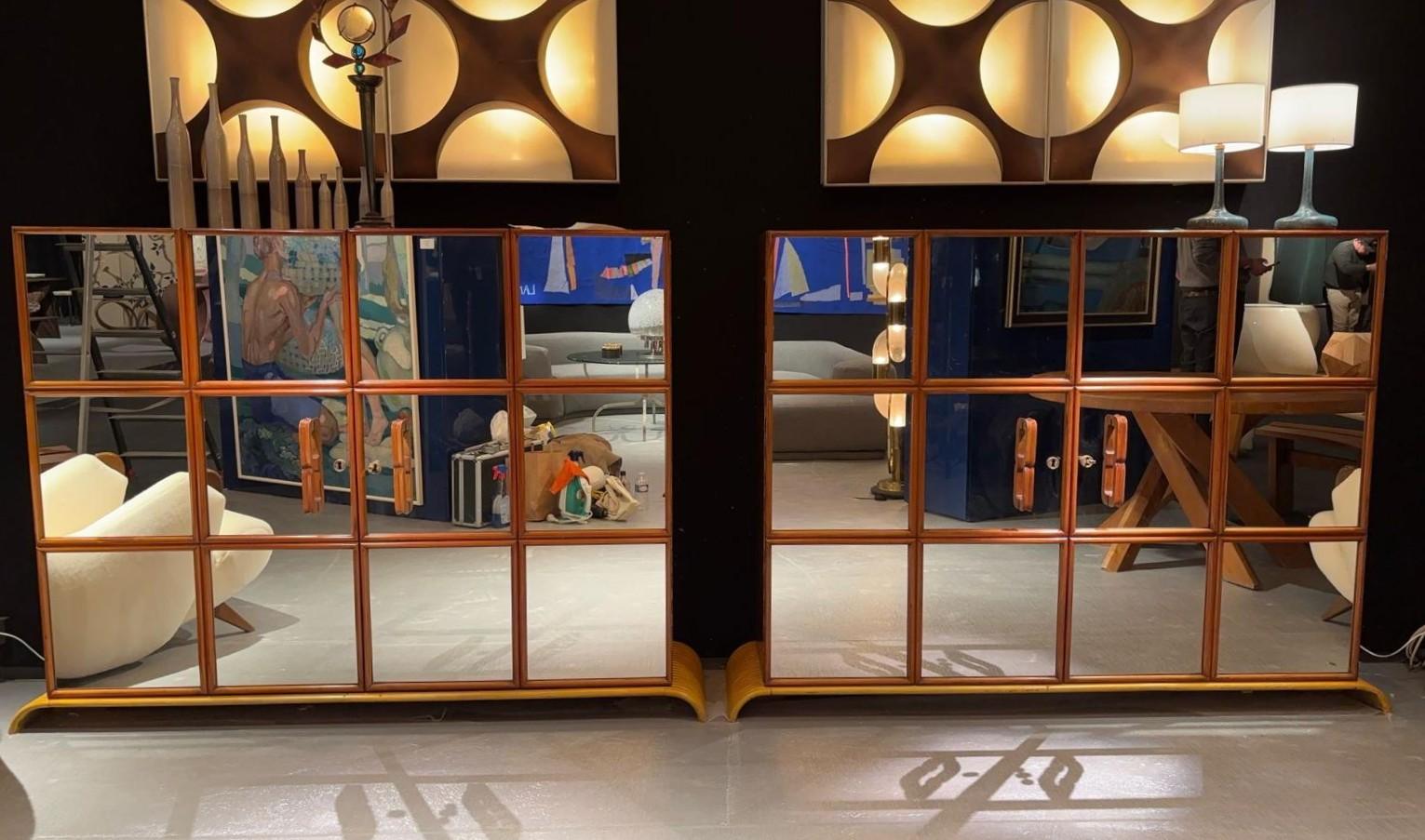 Pair of rectangular sideboards
Each front is decorated with twelve mirrors and opens with two doors revealing shelves
Cherrywood and glass 
Casa Moderna
Italy, 20th century
H. 129 cm x W. 159.5 cm x D. 39.5 cm (each)