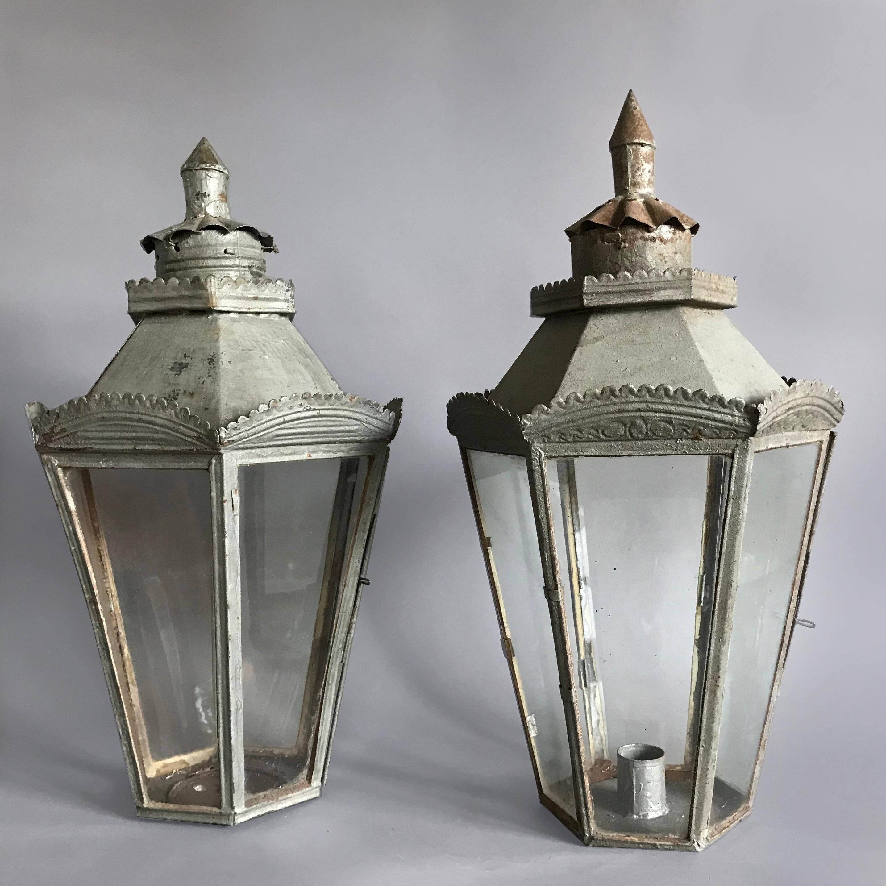 A charming pair of Italian C19th hexagonal toleware lanterns with punched and scalloped decoration.