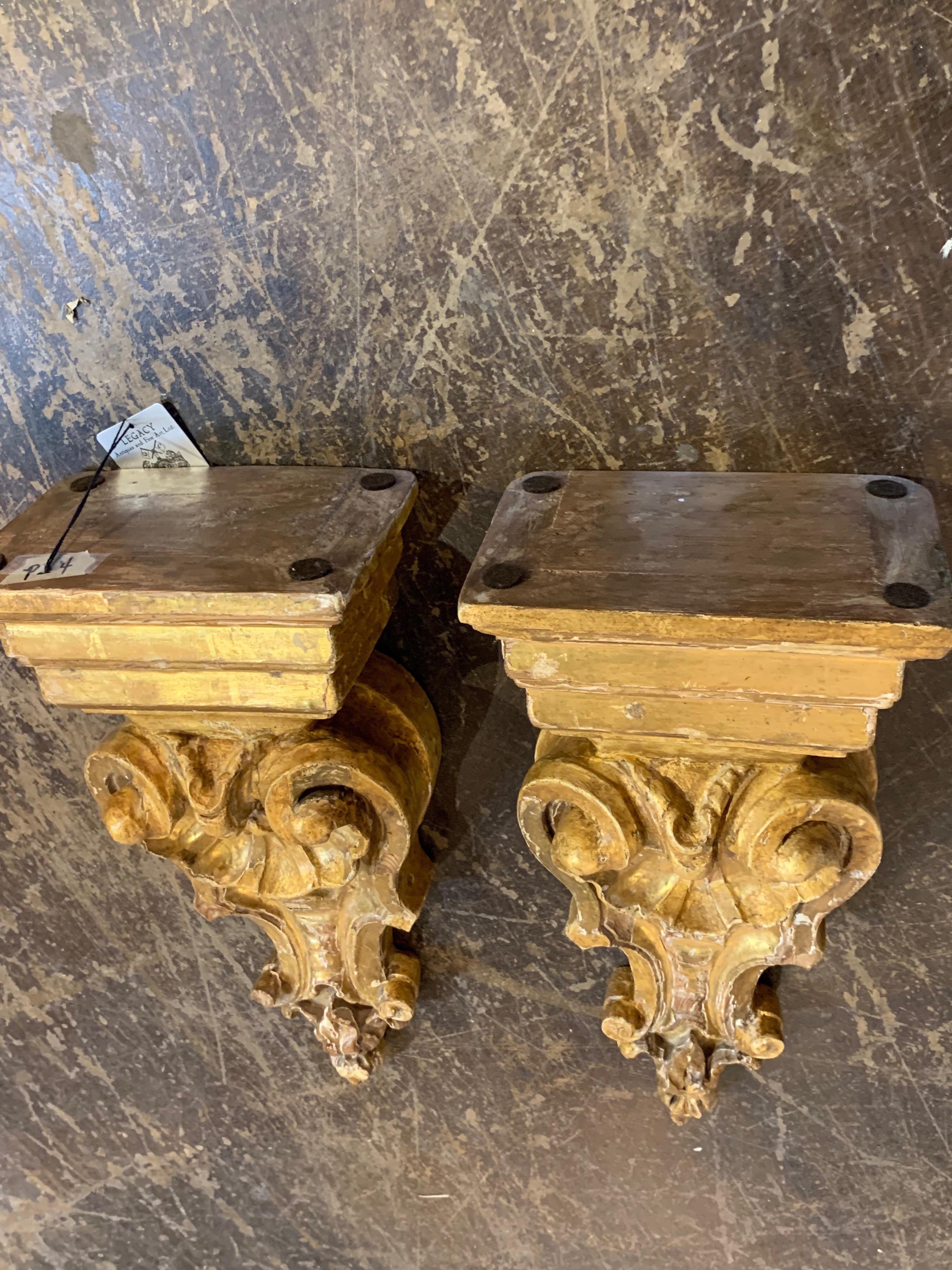 Lovely pair of Italian carved giltwood wall brackets. Beautiful gilt on these! A nice accessory for a fine home.