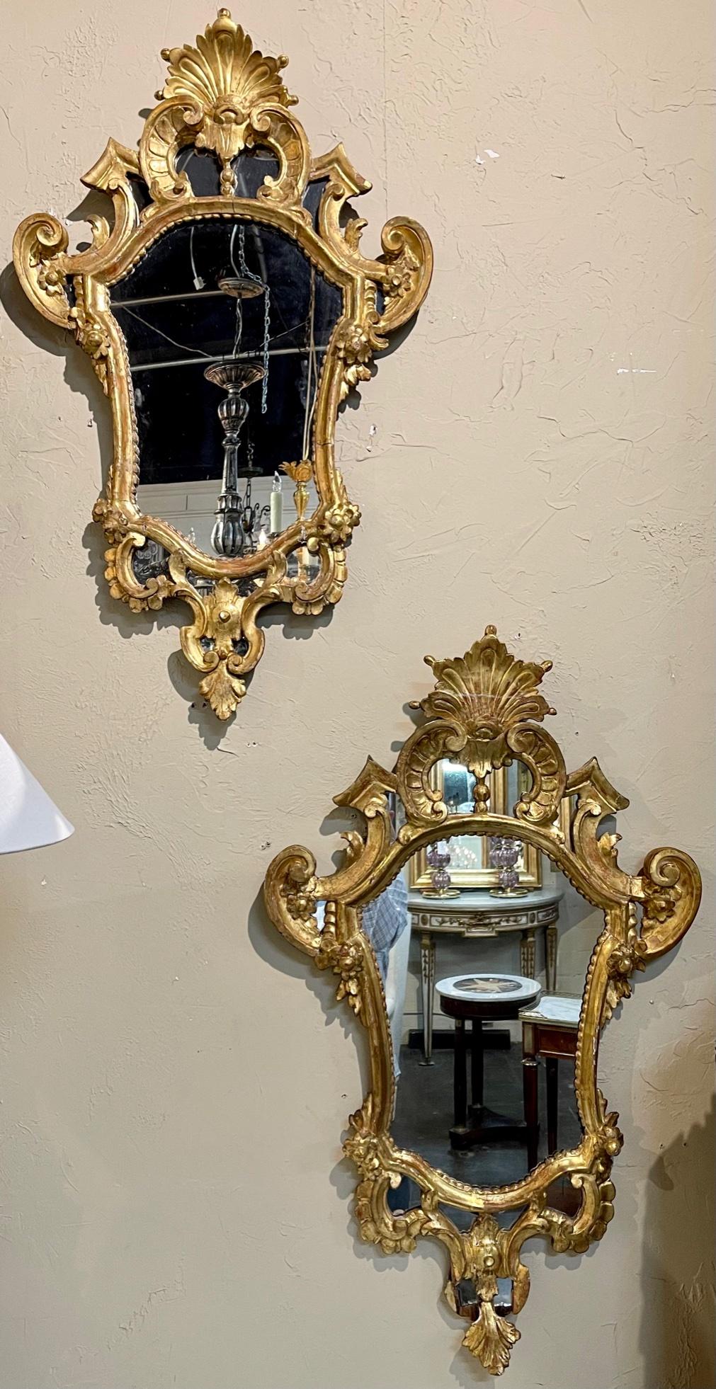 Pair of early 19th century Italian carved and giltwood mirrors. Circa 1840. Adds warmth and charm to any room!
Note: Sold as a pair.