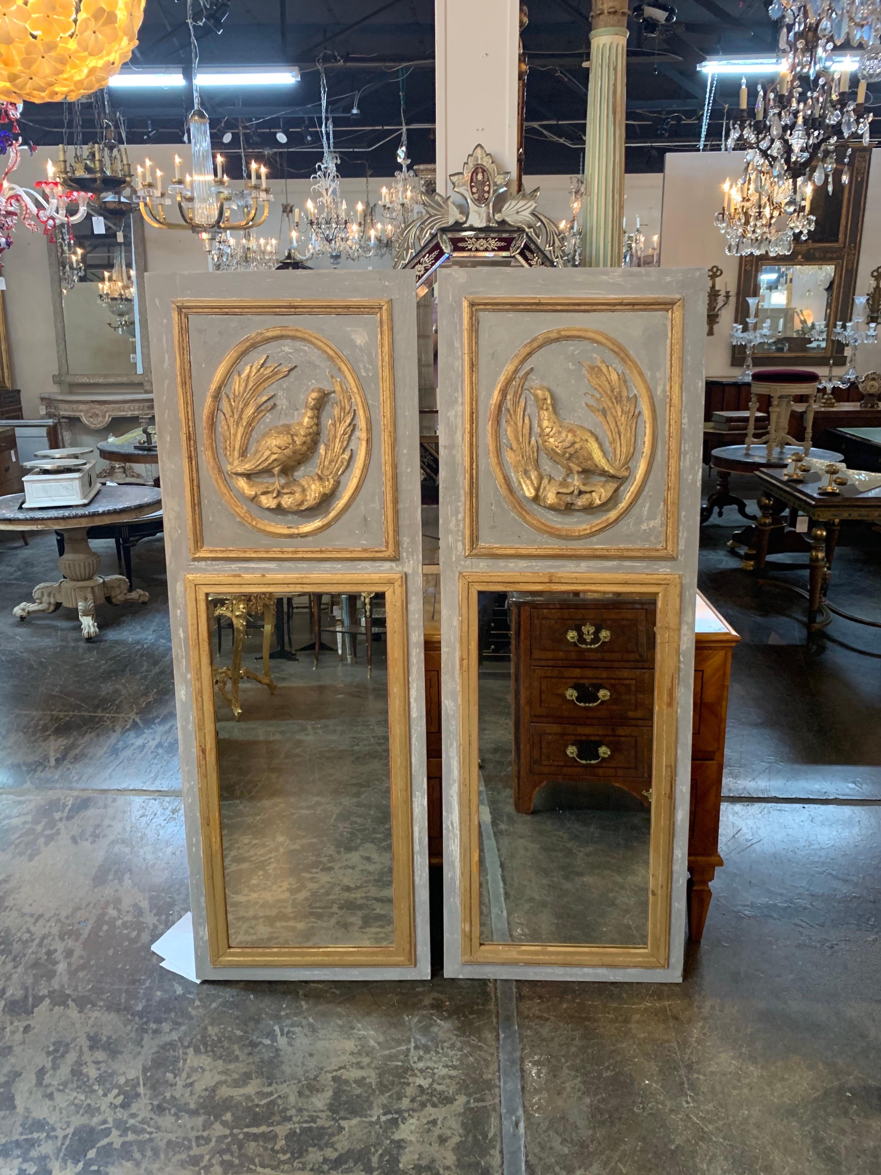 Very fine pair of Italian carved and parcel-gilt Trumeau mirrors with birds. Painted in a nice shade of grey with pretty carvings of birds and leaves. A fabulous decorative element!