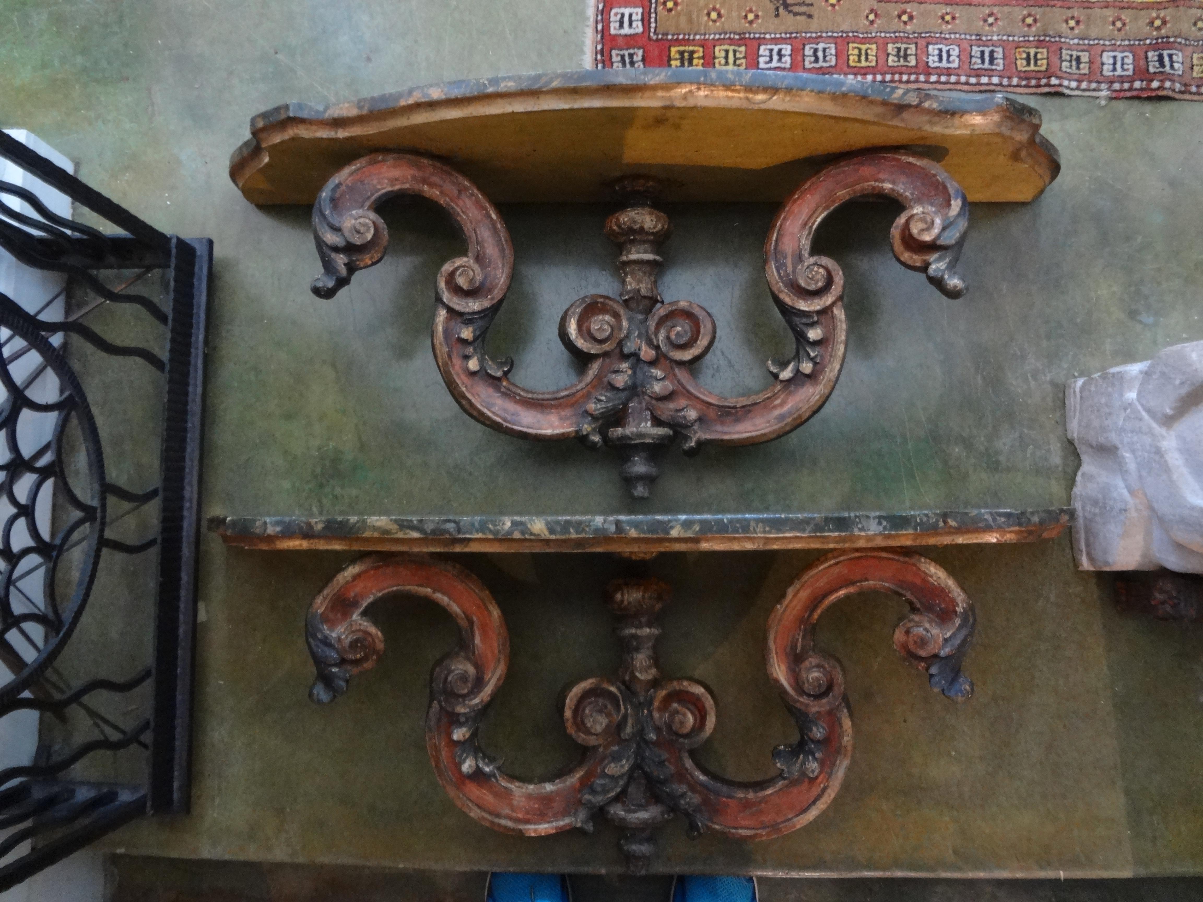 Pair of Italian carved and Polychrome wall brackets.
Fabulous huge pair of Italian carved and polychrome wall brackets, wall shelves or wall consoles. These great Tuscan wall brackets are executed in shades of greens, golds and reds with beautiful