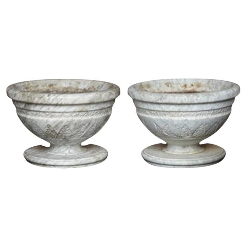 Pair of Italian Carved Marble Neoclassical Urns with Lotus Motif For Sale