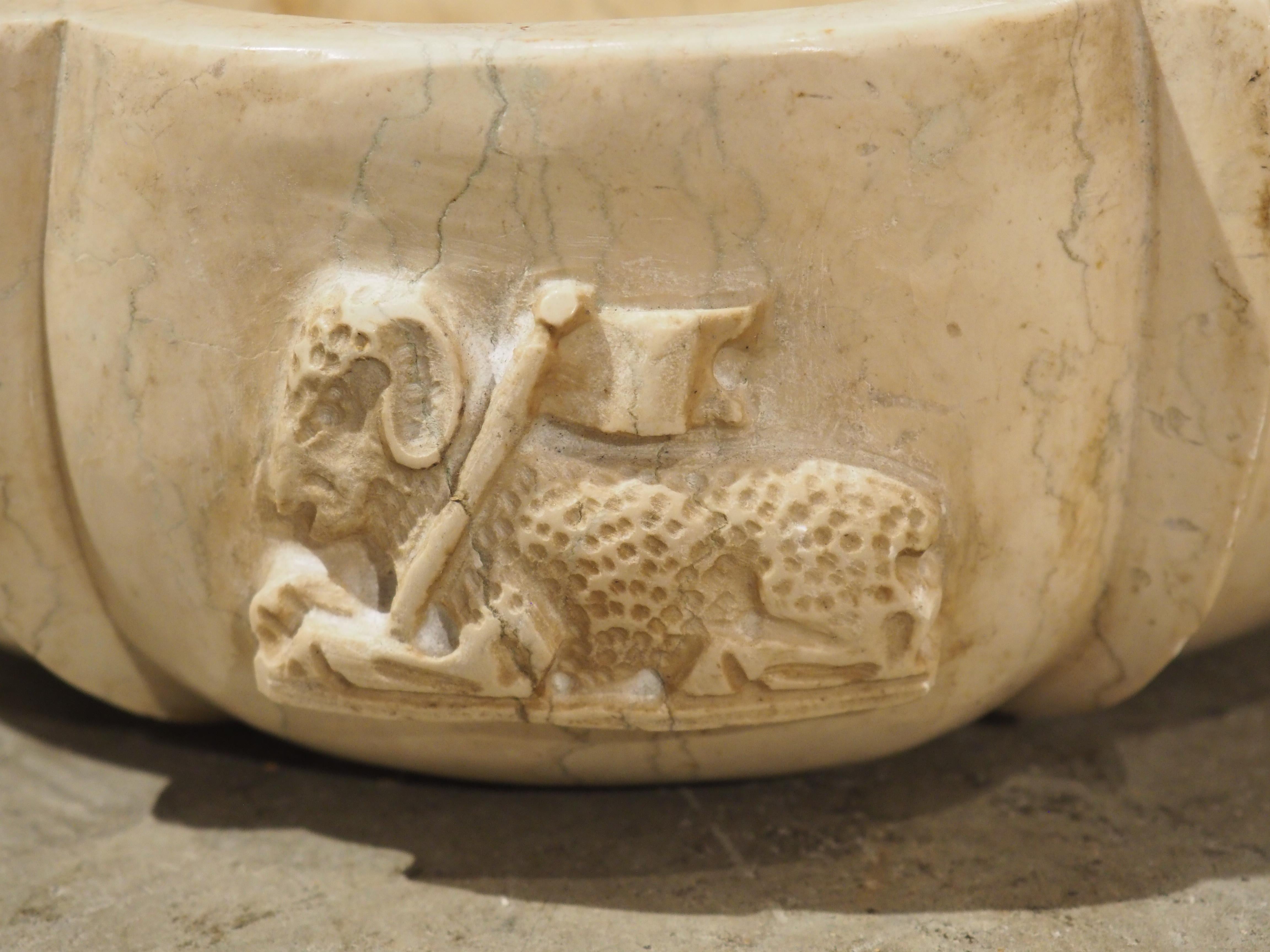 Stone Pair of Italian Carved Marble Stoups with Relief of The Paschal Lamb For Sale