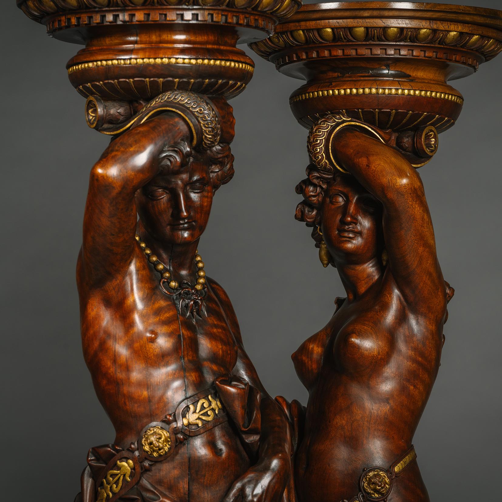 Hand-Carved Pair of Italian Carved Walnut and Parcel Gilt Figural Torchères  For Sale