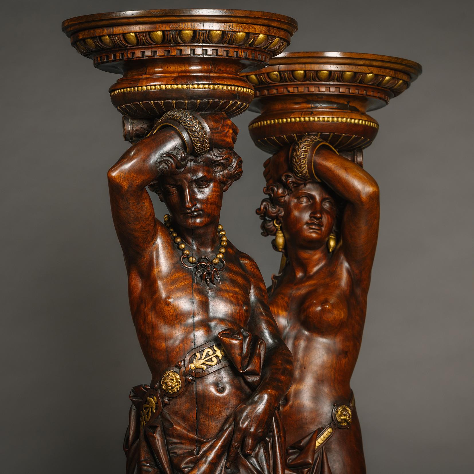 Pair of Italian Carved Walnut and Parcel Gilt Figural Torchères  In Good Condition For Sale In Brighton, West Sussex
