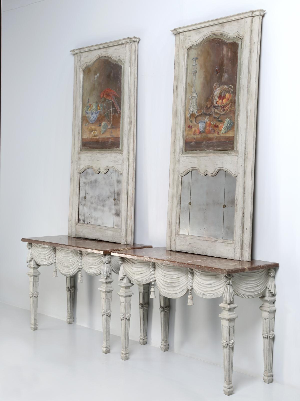Pair of Italian console tables with trumeau mirrors. We have been importing from Europe for almost 30-years now and every once in a while, you get stumped about an item’s history or what it really is? Well, as hard as we look, we are completely