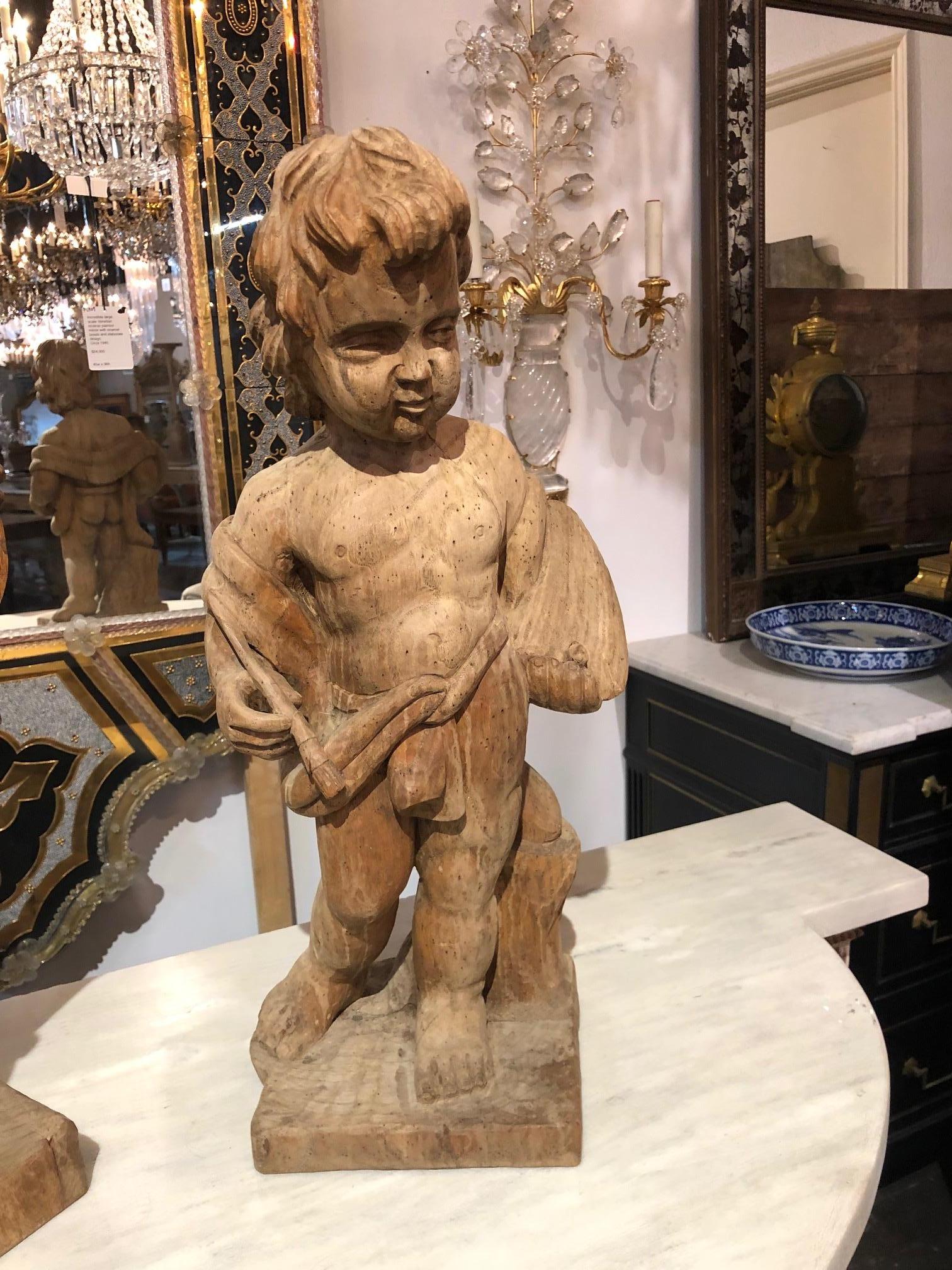 Pair of musical cherubs hand-carved in Italy out of bleached walnut.
Measures: 22