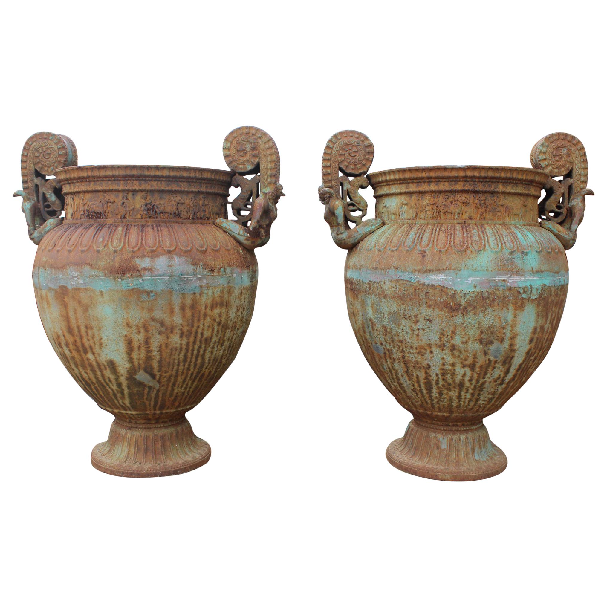 Pair of Italian Cast Iron Urns with Women and Lions Handles